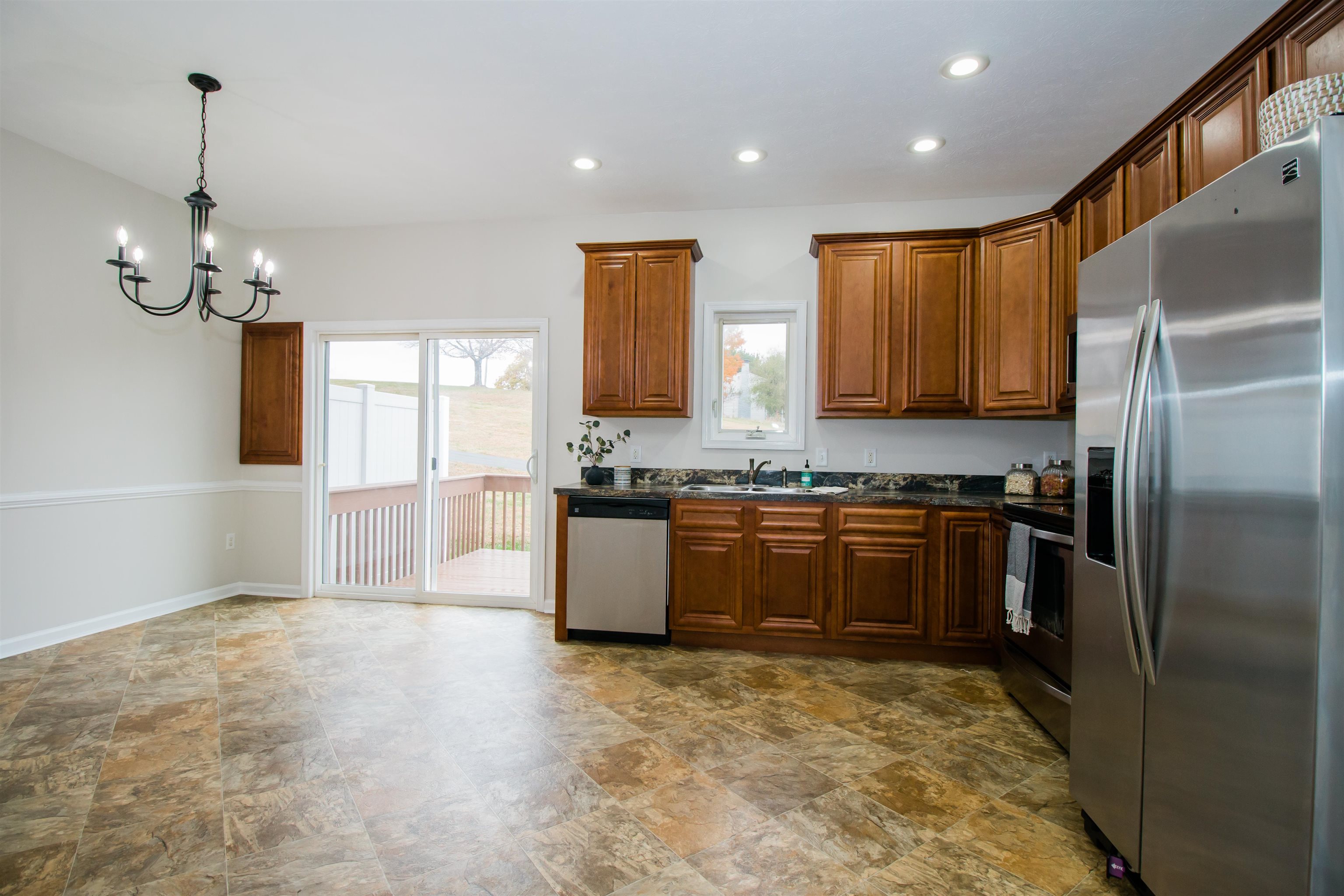 *Wood cabinets *Formica countertops *recessed lighting and chandelier *Wood cabinets *Formica countertops *recessed lighting and chandelier