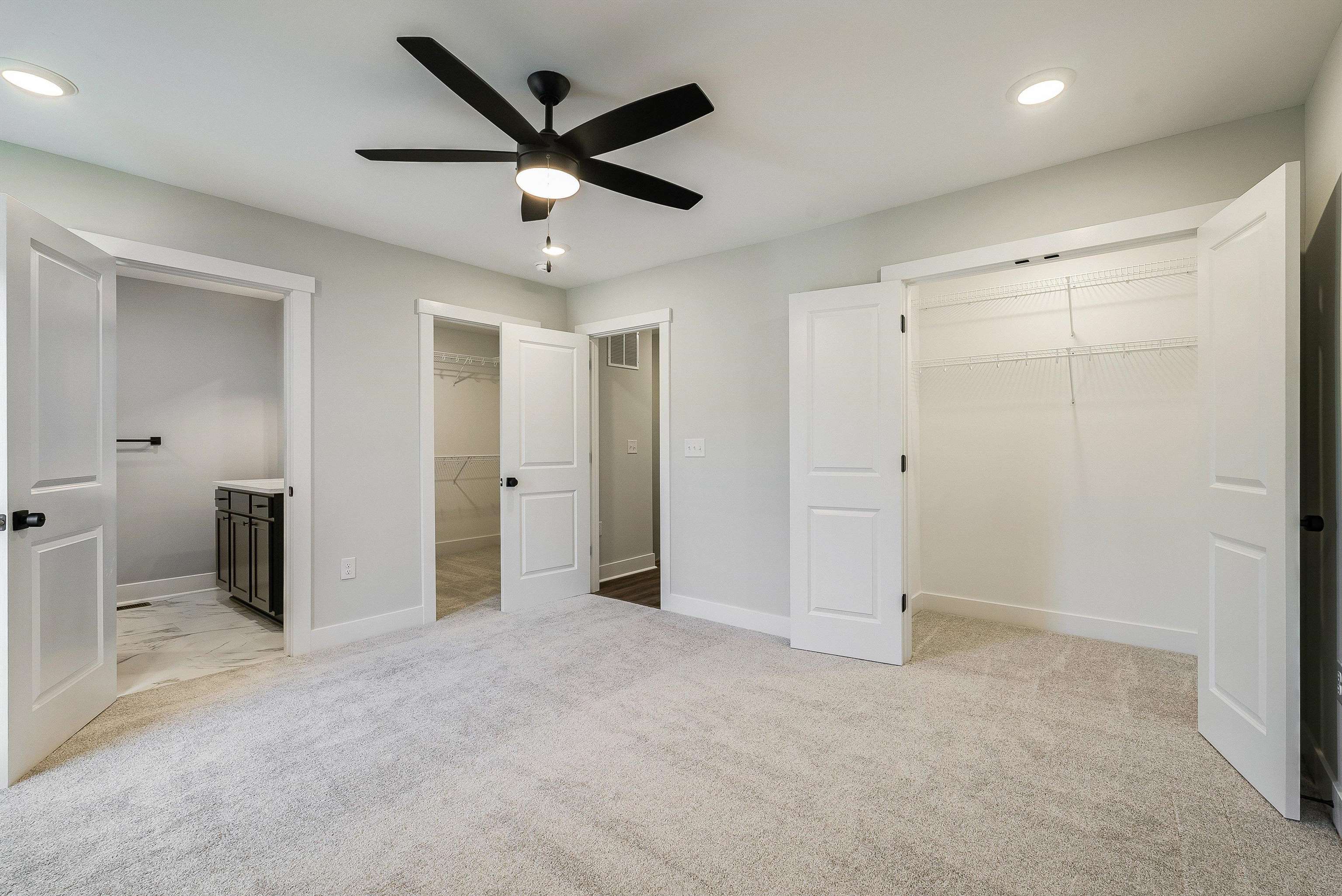 Spacious primary bedroom has 2 walk in closets and an en suite bath. Spacious primary bedroom has 2 walk in closets and an en suite bath.