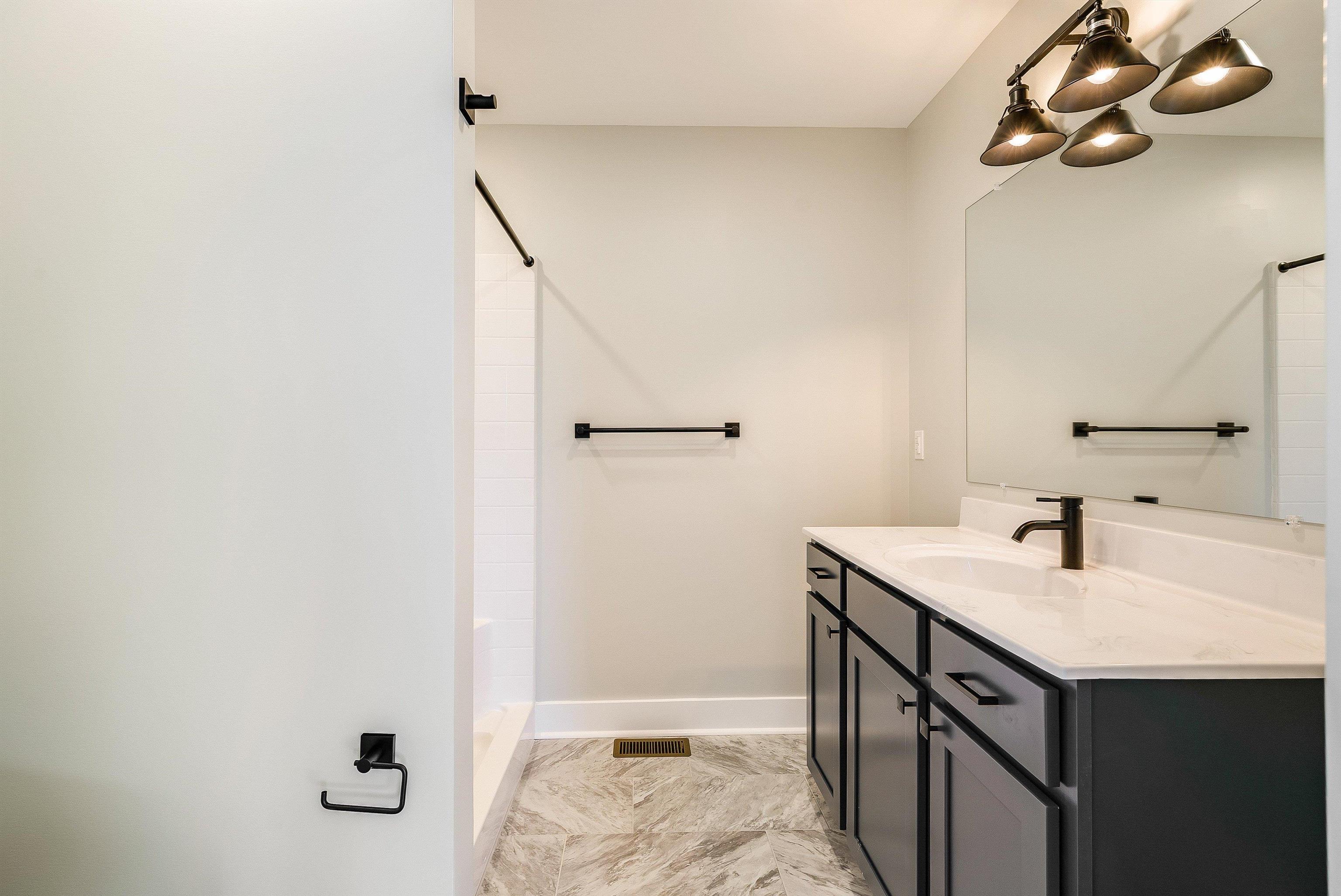 Primary bath comes standard with large single vanity with cultured marble countertop and walk in shower. Primary bath comes standard with large single vanity with cultured marble countertop and walk in shower.