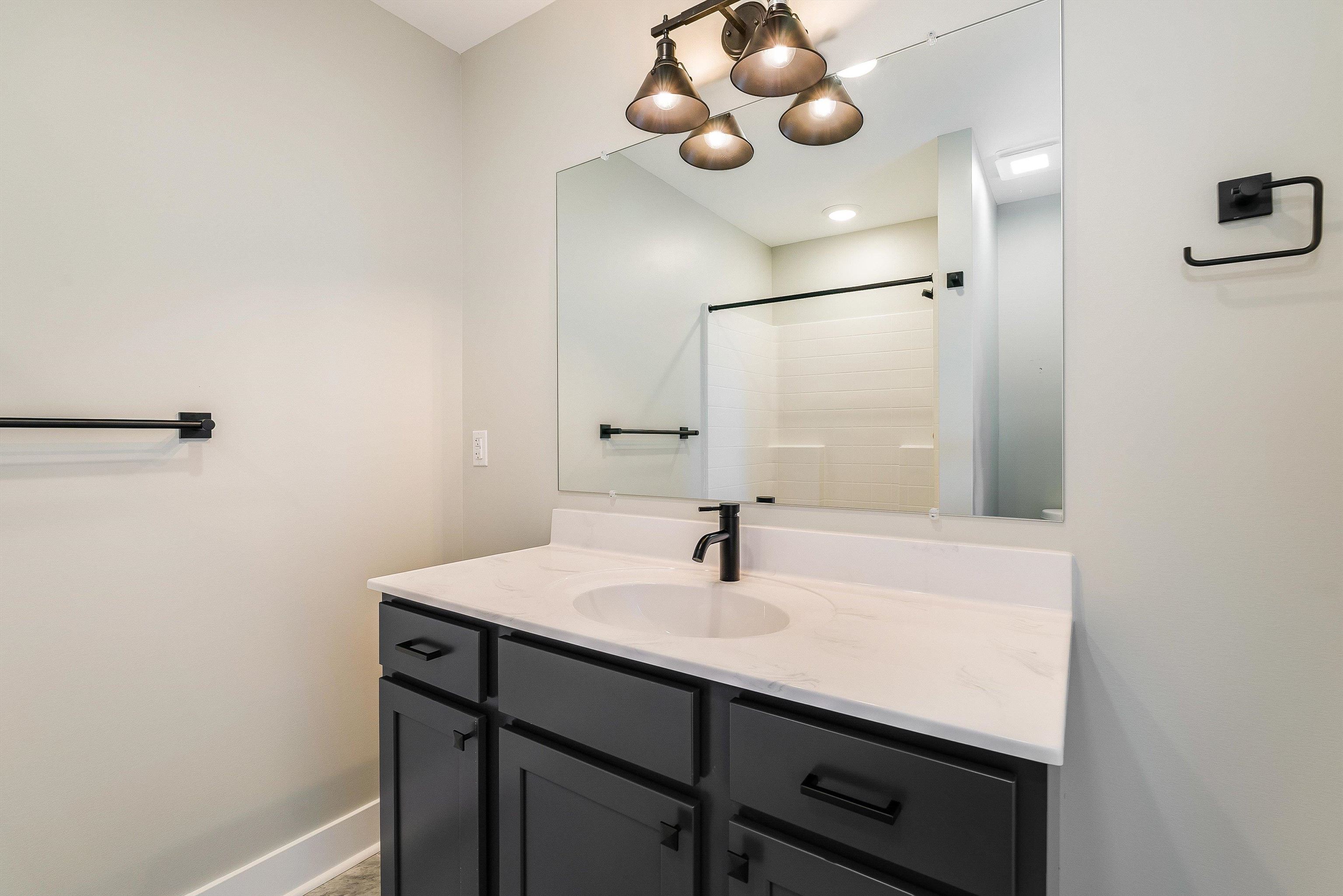 Primary bath comes standard with large single vanity with cultured marble countertop and walk in shower. Primary bath comes standard with large single vanity with cultured marble countertop and walk in shower.