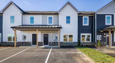 White/Gray Exterior with LP Smart Siding and 2 parking spaces.