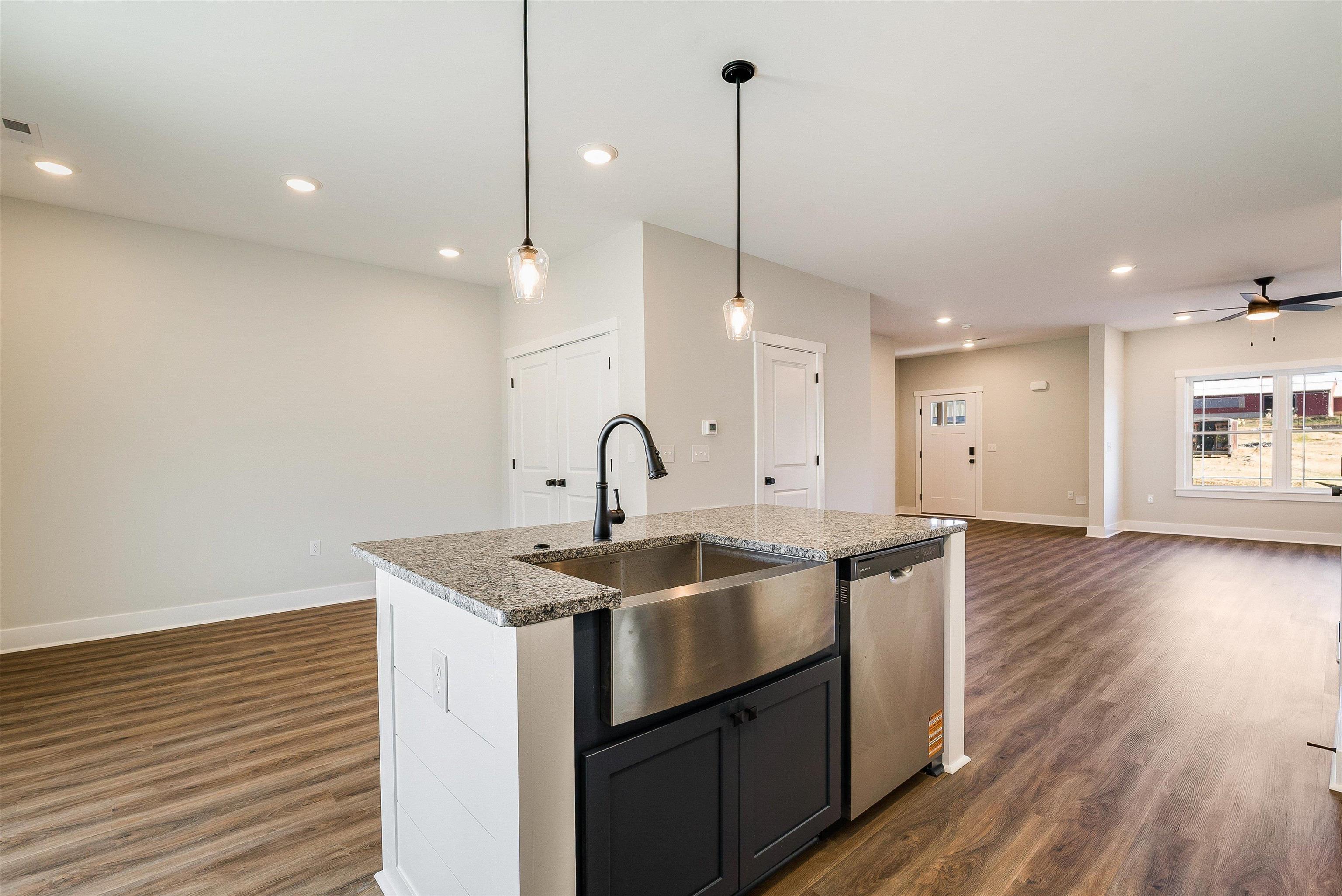 Kitchen features a large island and is open to dining area and living room Kitchen features a large island and is open to dining area and living room