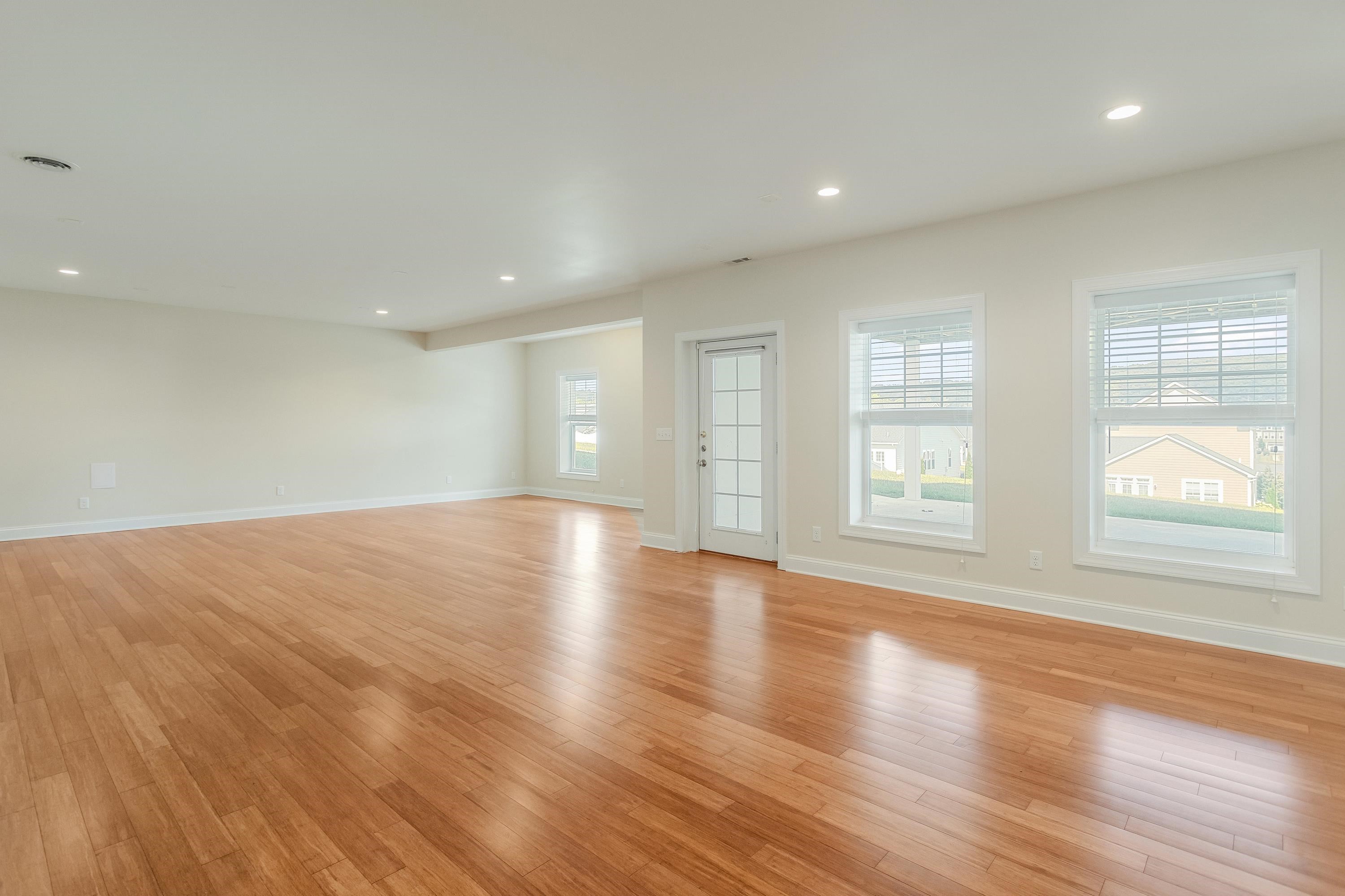 The expansive recreation room if large enough for mutliple uses and features recessed lighting, lots of large windows, laminant flooring throughout, and exterior door leading to the rear of the home.