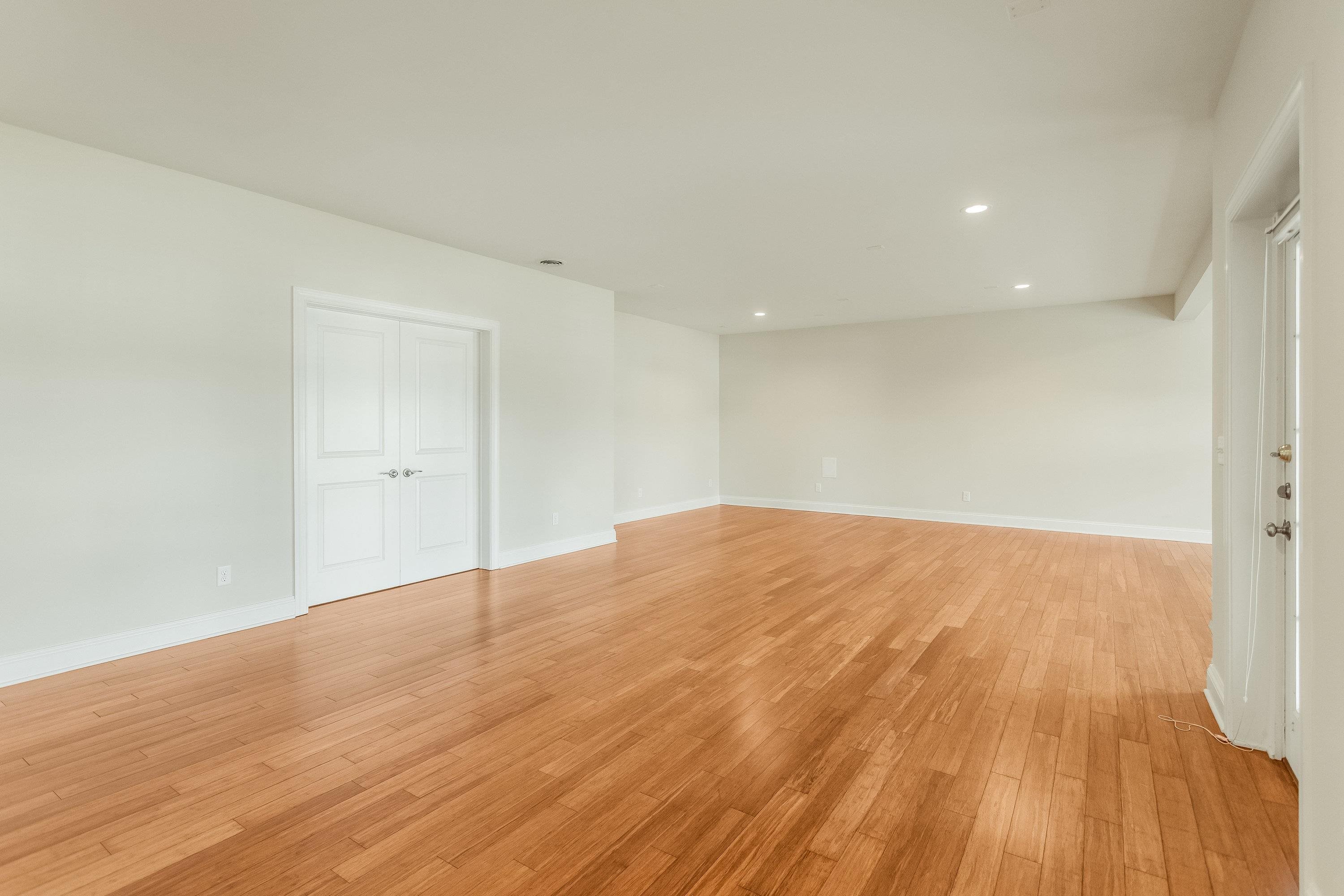 The expansive recreation room if large enough for mutliple uses and features recessed lighting, lots of large windows, laminant flooring throughout, and exterior door leading to the rear of the home.