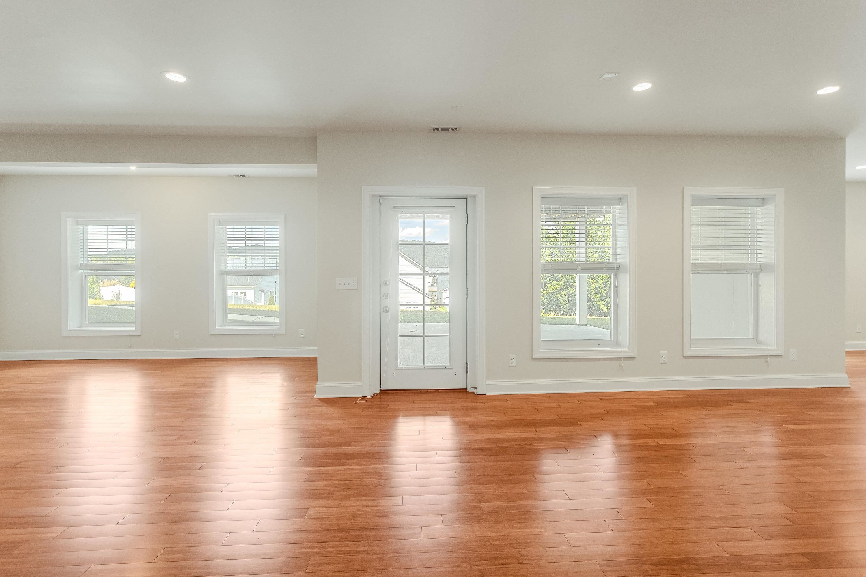 The expansive recreation room if large enough for mutliple uses and features recessed lighting, lots of large windows, laminant flooring throughout, and exterior door leading to the rear of the home.