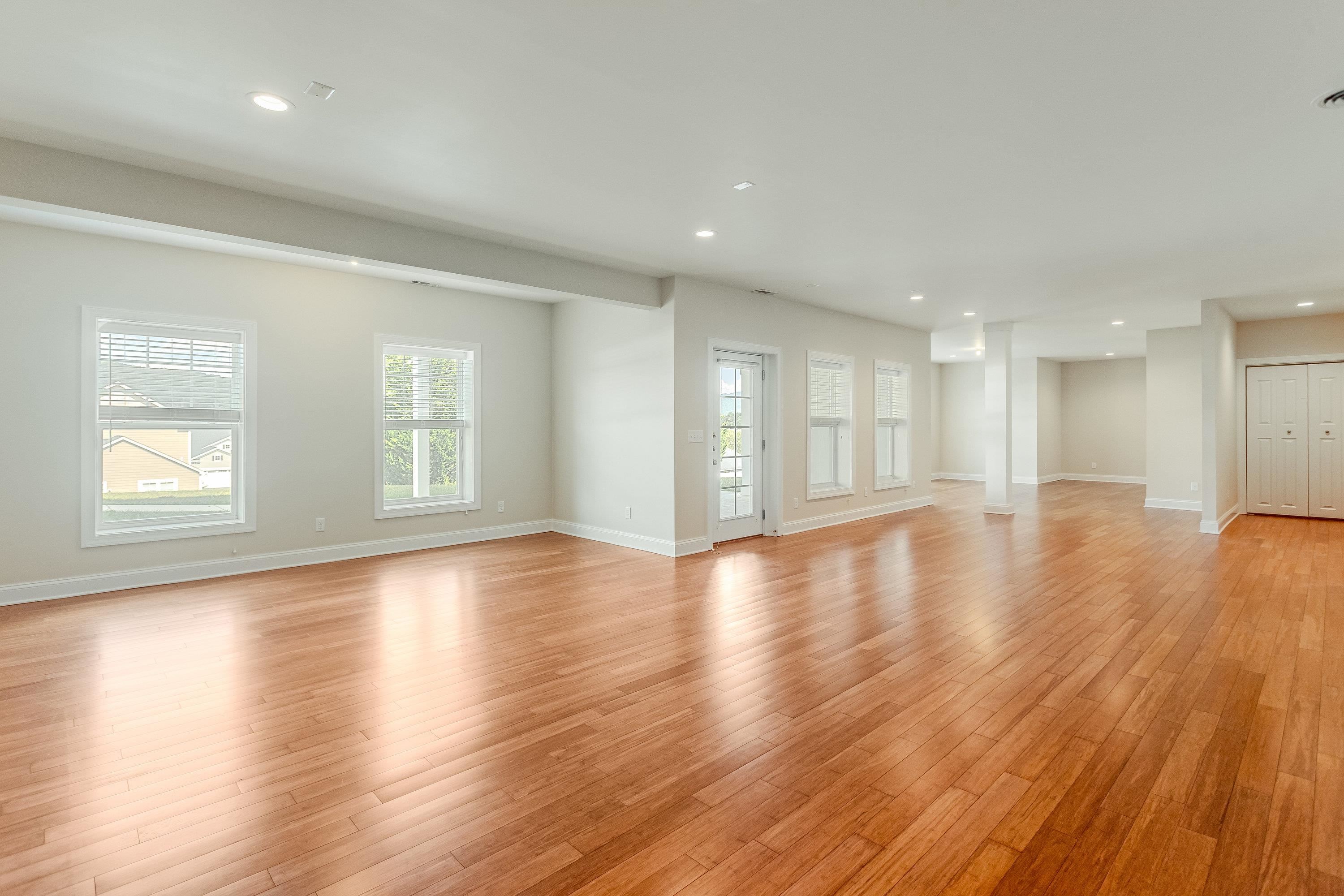 The expansive recreation room if large enough for mutliple uses and features recessed lighting, lots of large windows, laminant flooring throughout, and exterior door leading to the rear of the home.