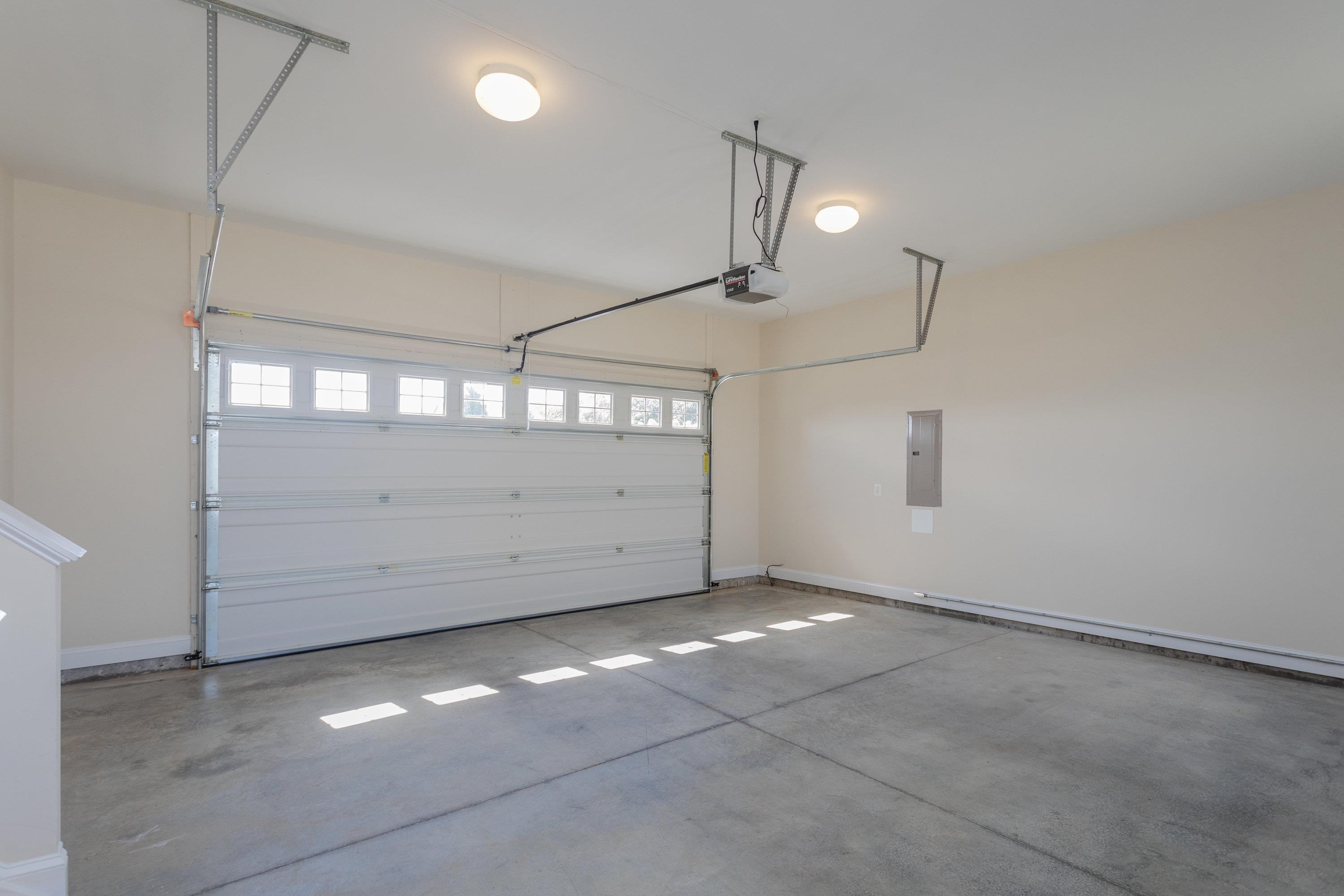 This home features a large attached two-car garage.  The garage offers a over-sized door and plenty of space for vehicles, storage, and more!