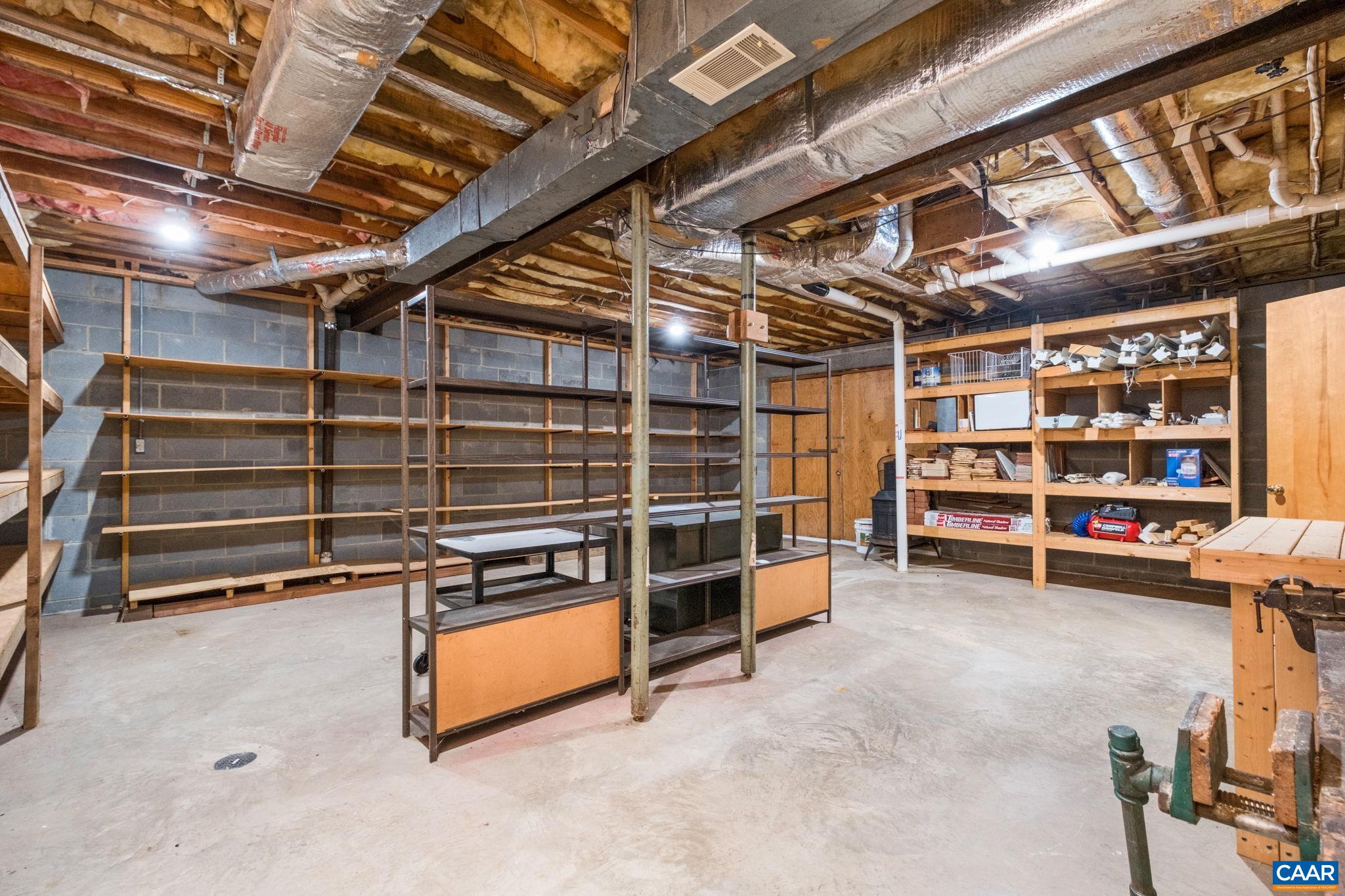 Large  double doors open to outside and loads of storage shelves