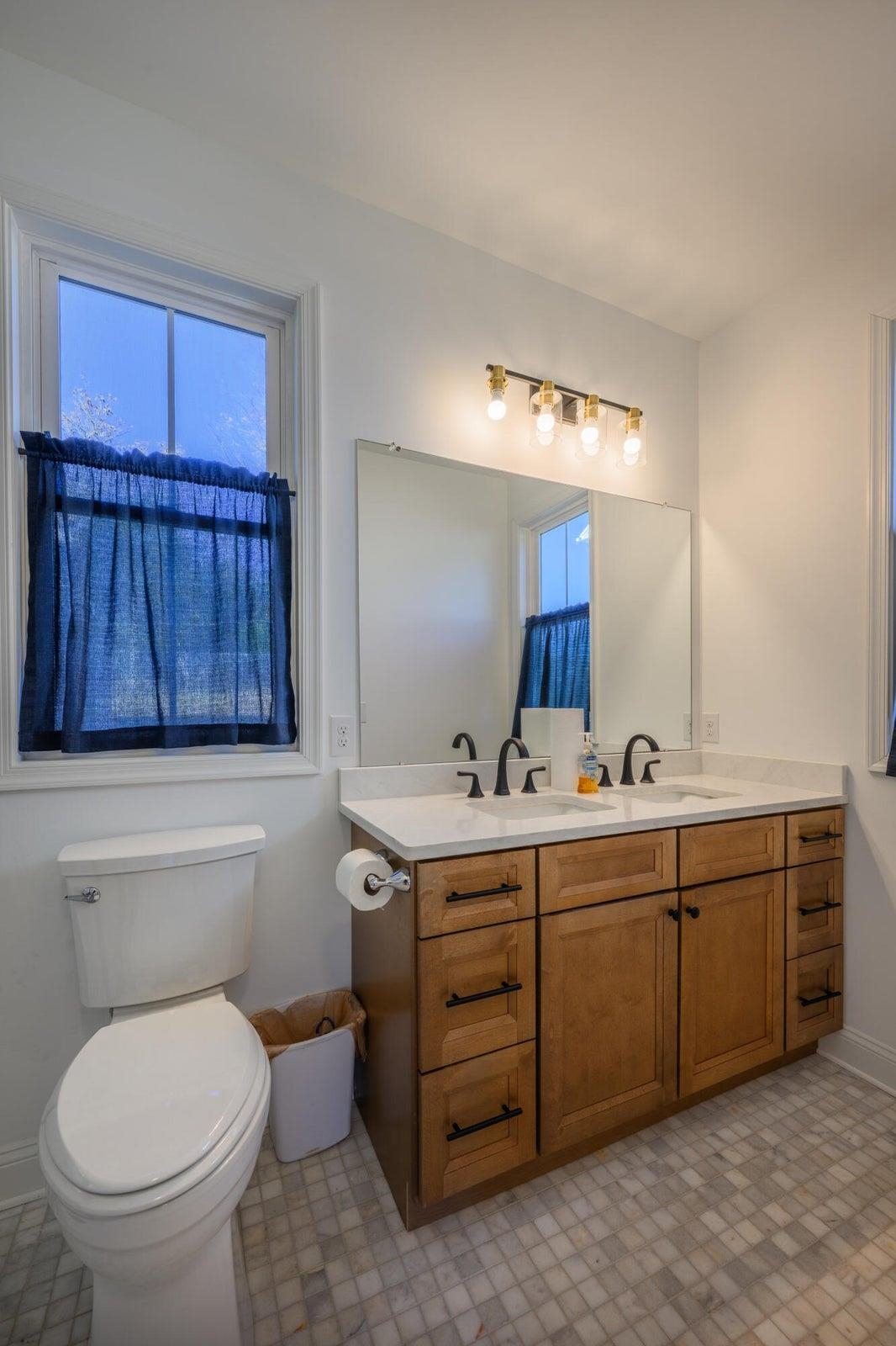 Master bath features marble tile and marble vanity. Master bath features marble tile and marble vanity.