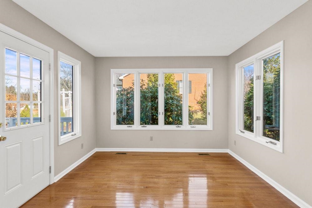 Room is filled with natural sunlight=very welcoming. Walks out to rear patio space.