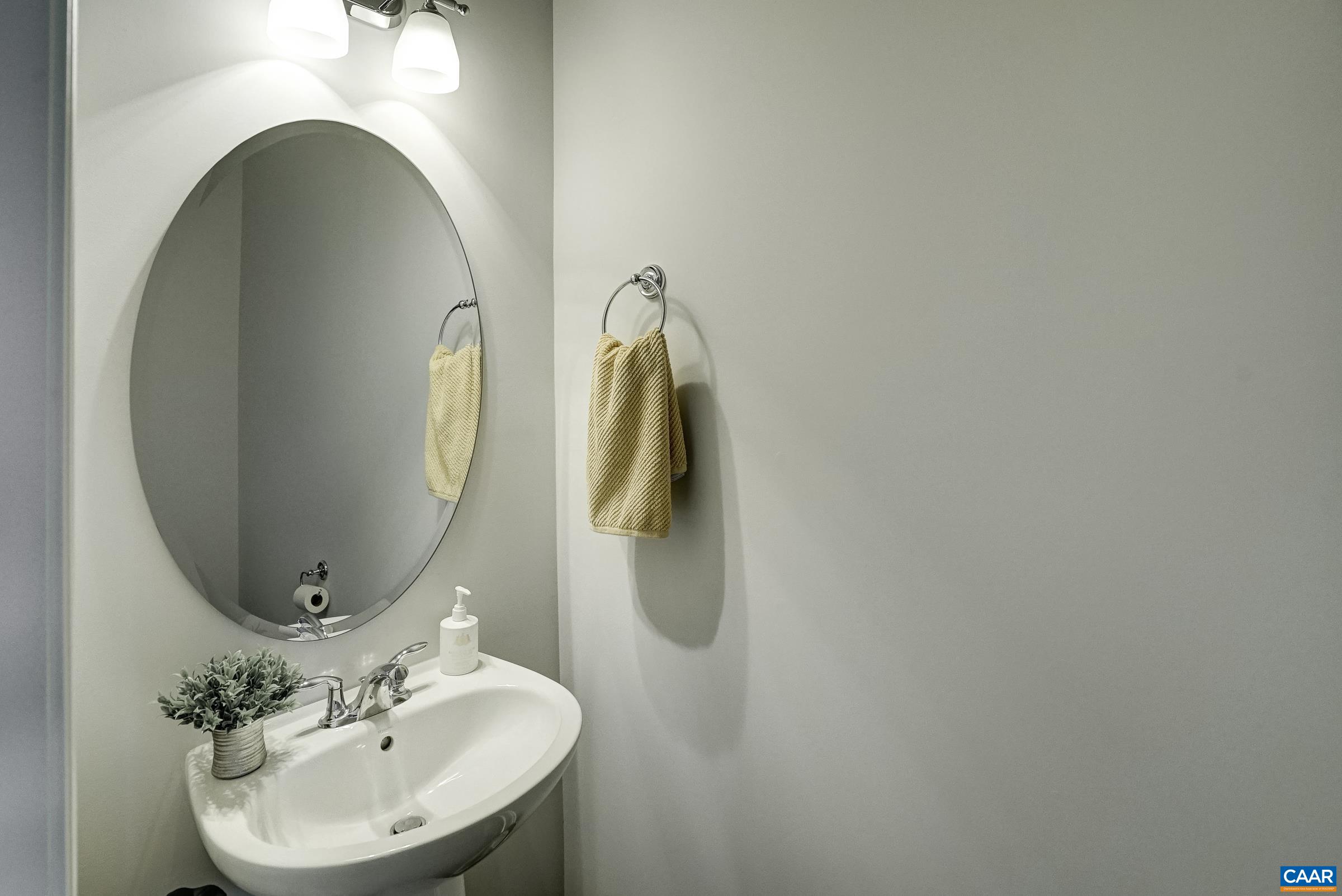 Half bathroom with pedestal sink. Half bathroom with pedestal sink.