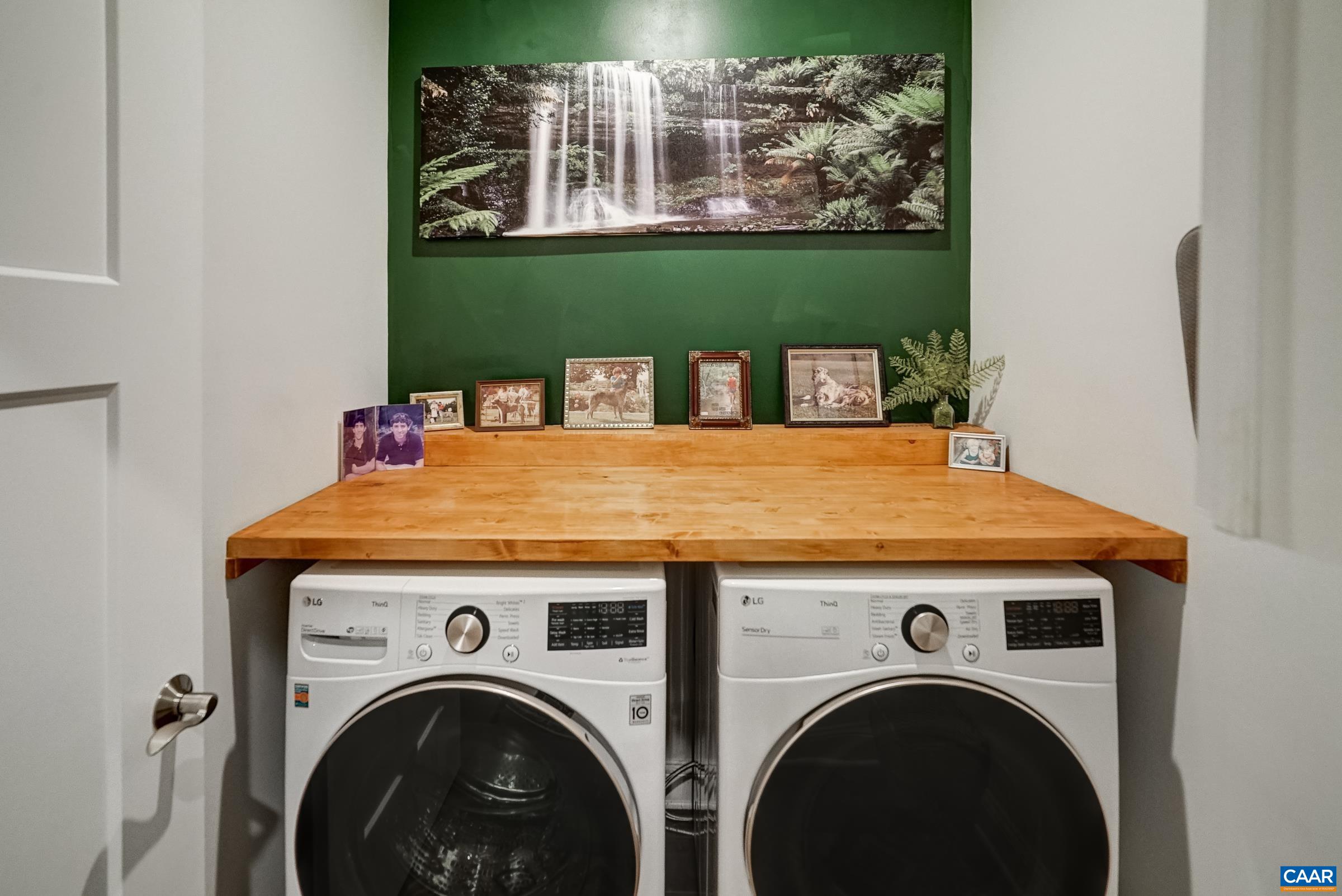 Laundry room features a solid shelf above for folding, and wall cabinet. Laundry room features a solid shelf above for folding, and wall cabinet.