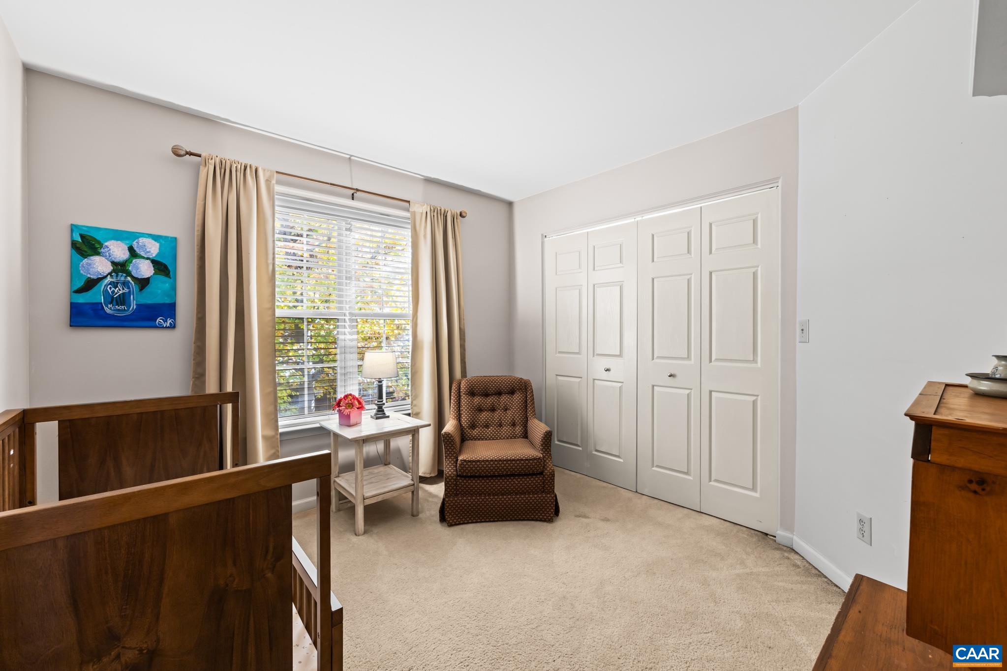 This versatile bedroom features neutral walls and carpet. The double-door closet and window with a view complete this functional and inviting space. This versatile bedroom features neutral walls and carpet. The double-door closet and window with a view complete this functional and inviting space.