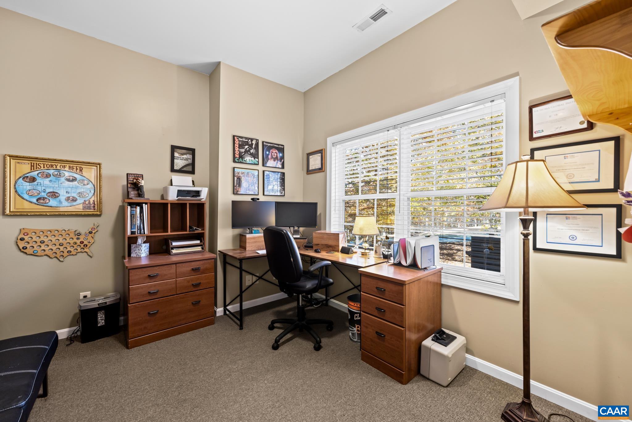 This spacious home office provides a private and productive workspace. Featuring bright natural light from a large window, it's the perfect dedicated area for working from home. This spacious home office provides a private and productive workspace. Featuring bright natural light from a large window, it's the perfect dedicated area for working from home.