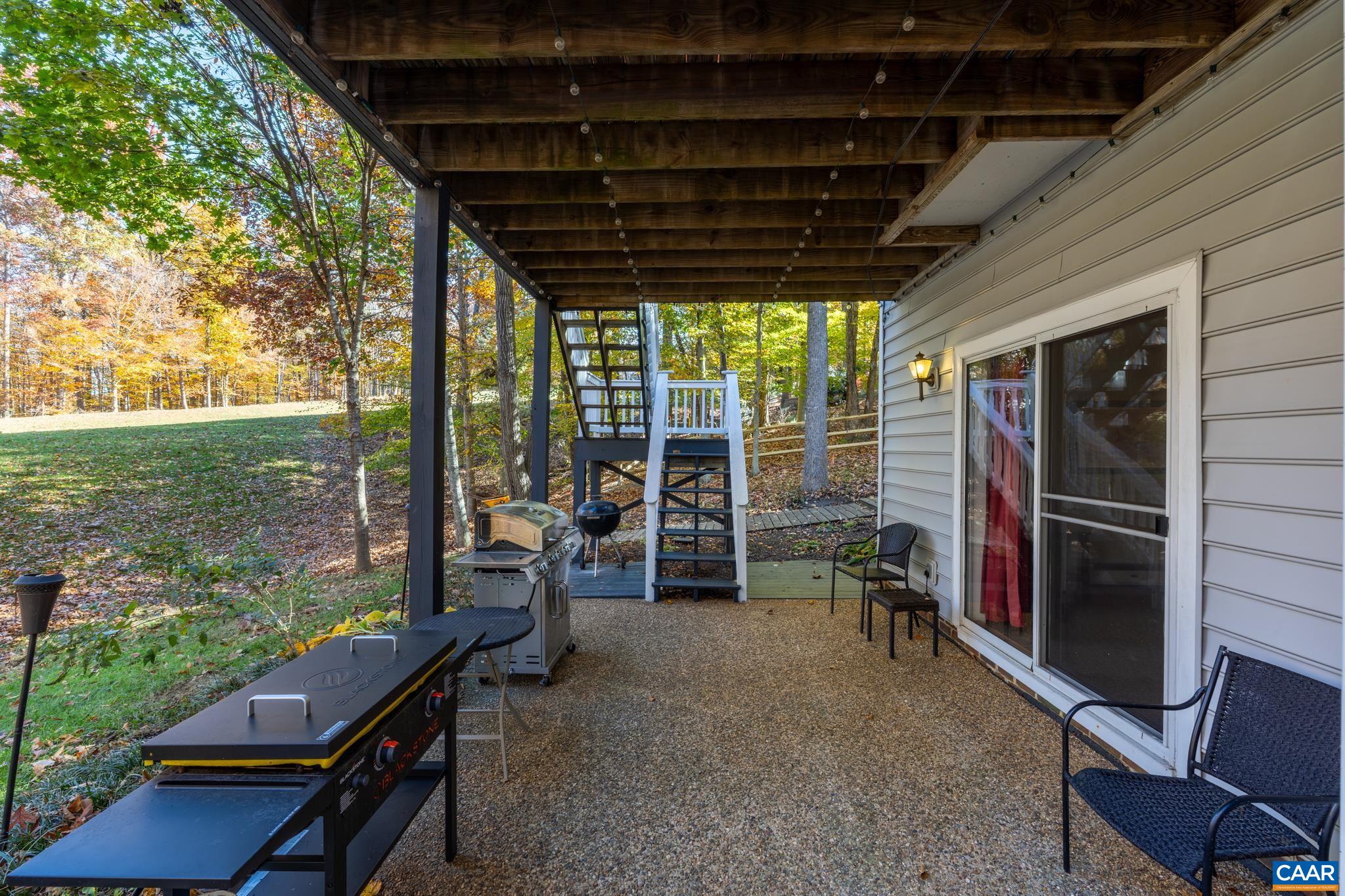 After a game of billiards in the basement, head out the convenient sliding glass door to under the covered outdoor oasis with a spacious patio, perfect for grilling and dining with steps leading to the upper deck. Wonderful entertaining space! After a game of billiards in the basement, head out the convenient sliding glass door to under the covered outdoor oasis with a spacious patio, perfect for grilling and dining with steps leading to the upper deck. Wonderful entertaining space!