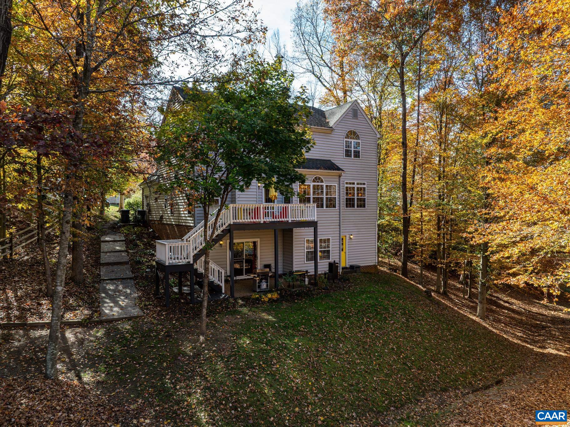 Enjoy a private, wooded setting with a spacious home featuring a walkout basement and a multi-level deck for outdoor enjoyment. Notice the side walk way offering a thoughtful path to the back yard, deck, and patio. Enjoy a private, wooded setting with a spacious home featuring a walkout basement and a multi-level deck for outdoor enjoyment. Notice the side walk way offering a thoughtful path to the back yard, deck, and patio.