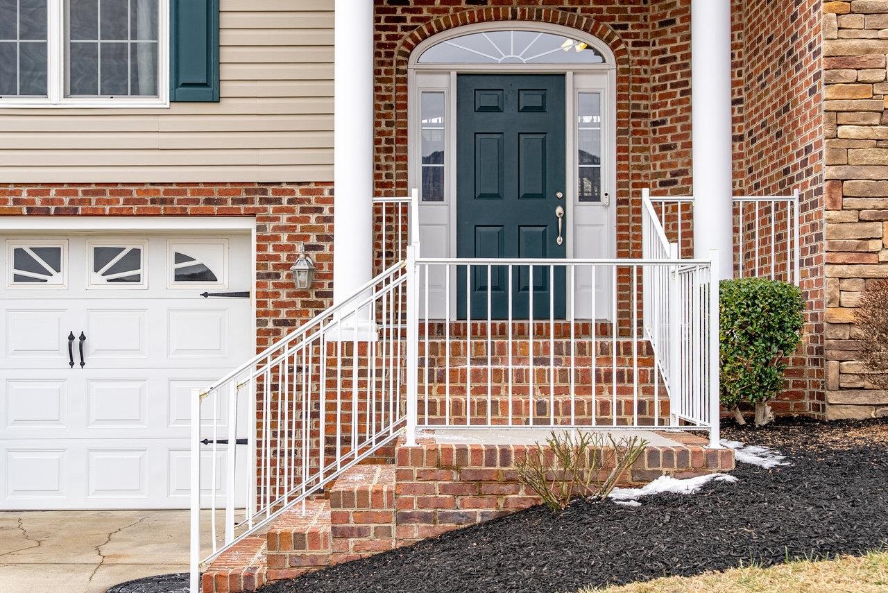 Features: Inviting stone-covered porch.