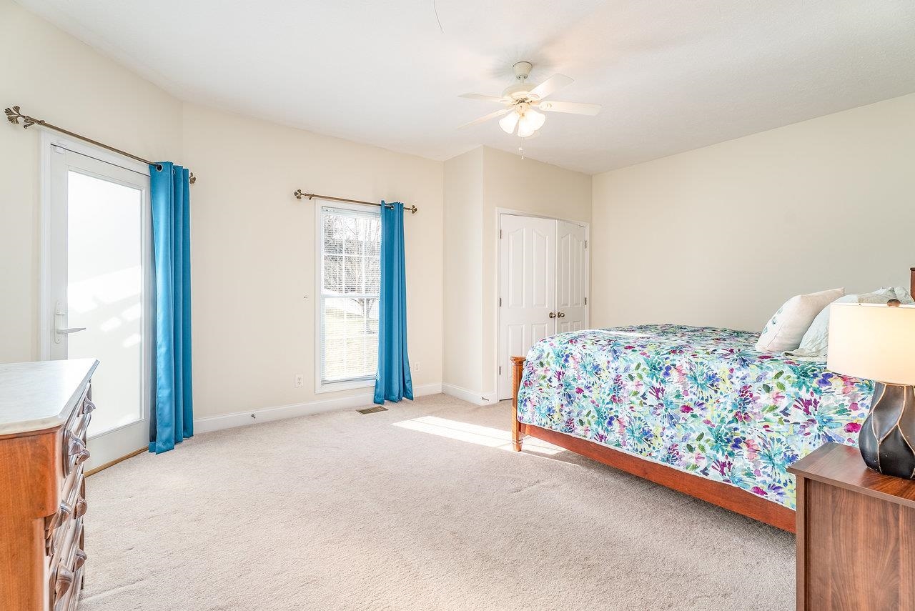 Features: Private access to the patio, spacious layout, a large closet, and cozy carpeted floors.