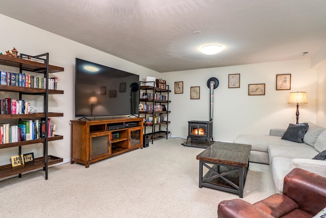 Features: The ultimate hangout space—perfect for movie nights, entertaining family and friends, or a fun kids’ play area, complete with a cozy pellet stove, carpet and a ceiling fan for comfort.