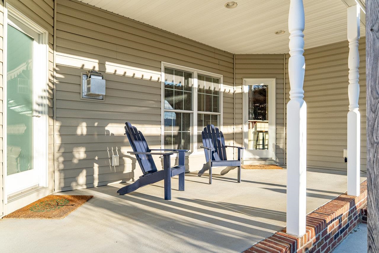 Features: Two distinct areas for relaxing and entertaining—a covered lounge area and an inviting patio featuring a pergola and spacious backyard, perfect for gatherings or quiet evenings outdoors.