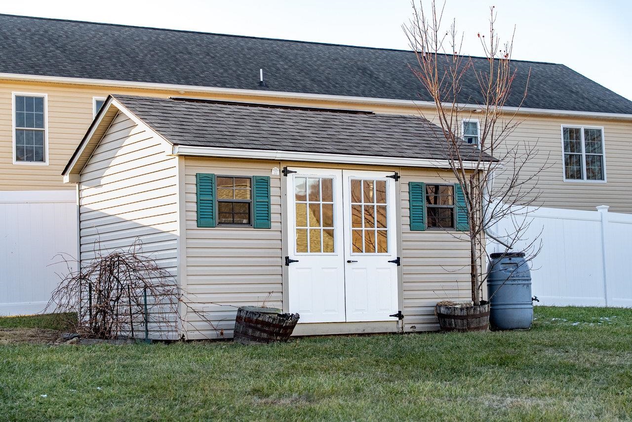 Features: Durable vinyl siding with extra storage space, perfect for your mower, gardening tools, and outdoor essentials.