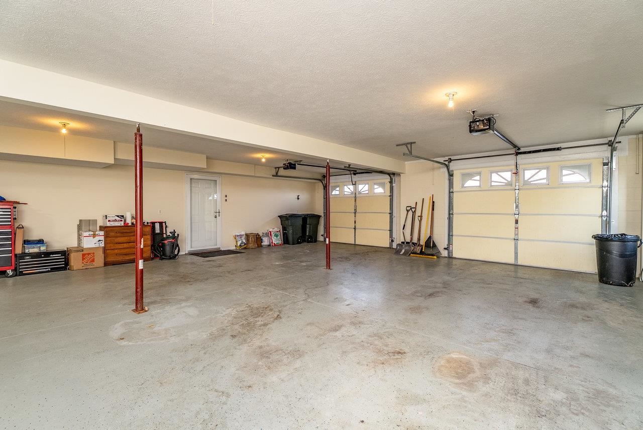 Features: Expansive 1,098 sq ft garage with space for four vehicles, a workshop, or the perfect setup for hobbies and projects of any kind.