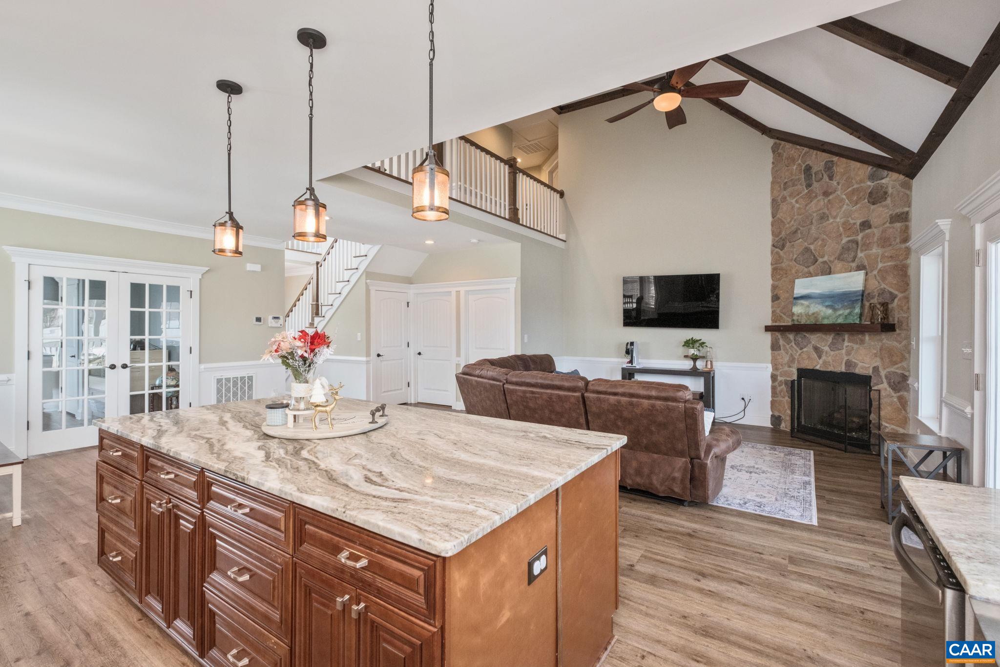 The kitchen, great room, and dining area are open concept.