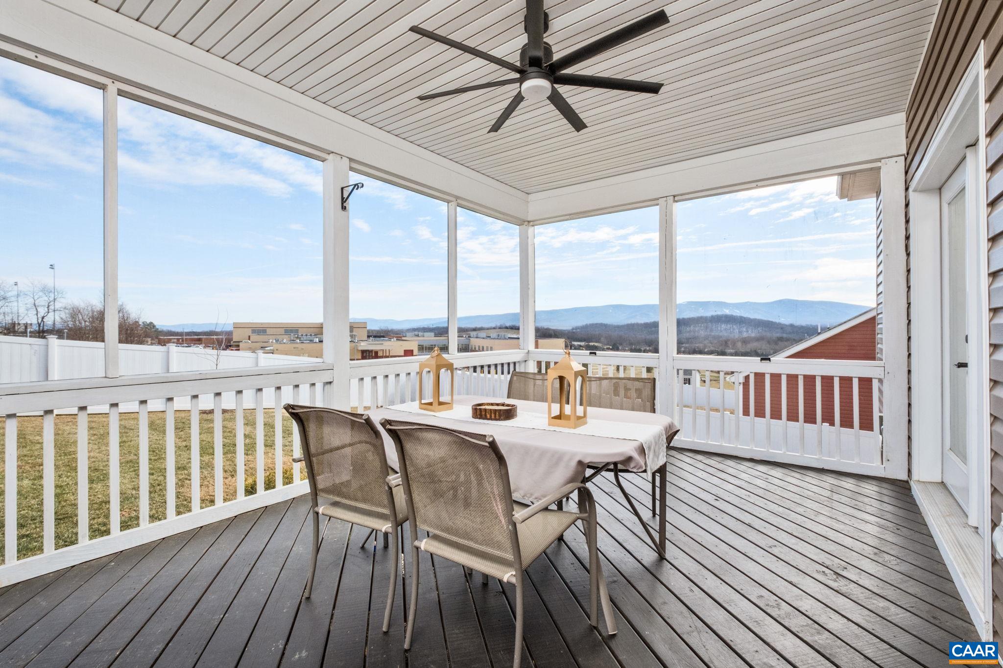 The screened-in porch is just off of the kitchen and great room, and it overlooks a fully fenced backyard.  Enjoy mountain views from the porch!