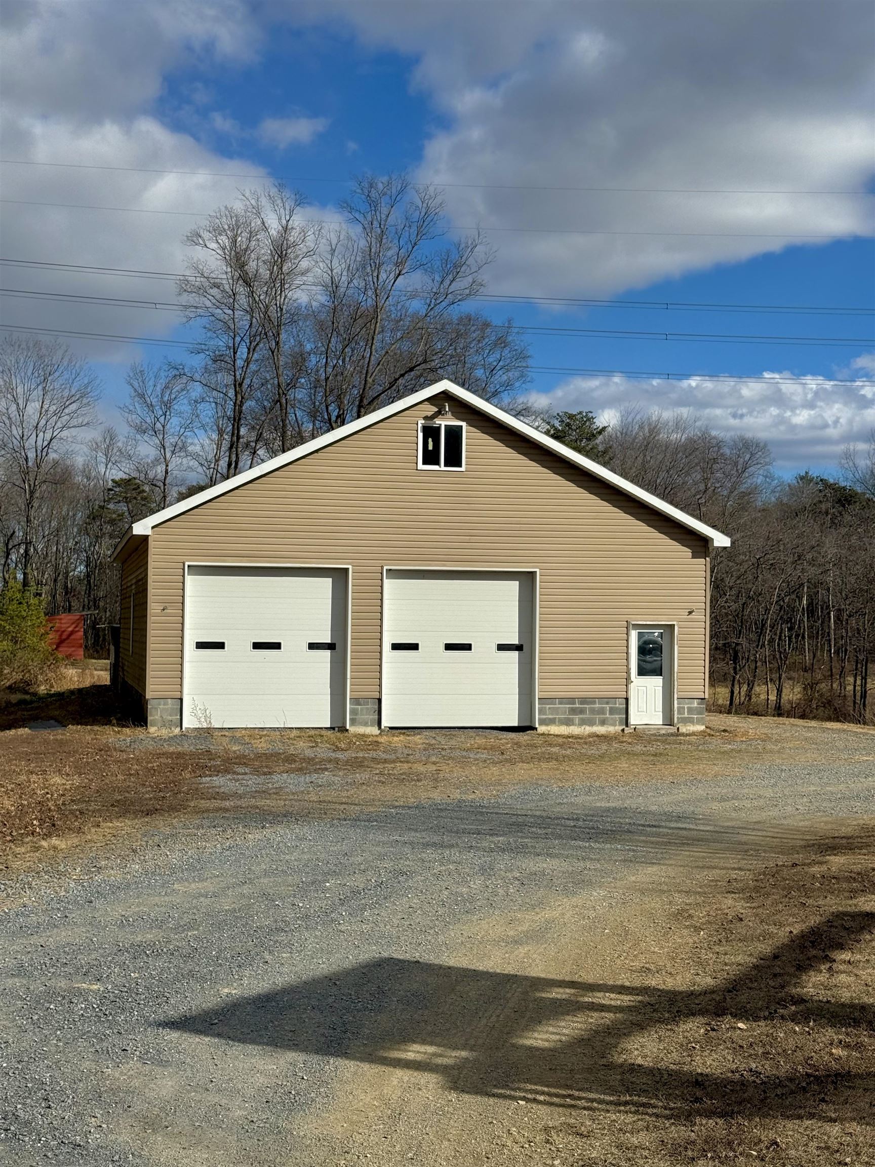 With electric, roughed in plumbing for full bathroom, and floored walkup attic.