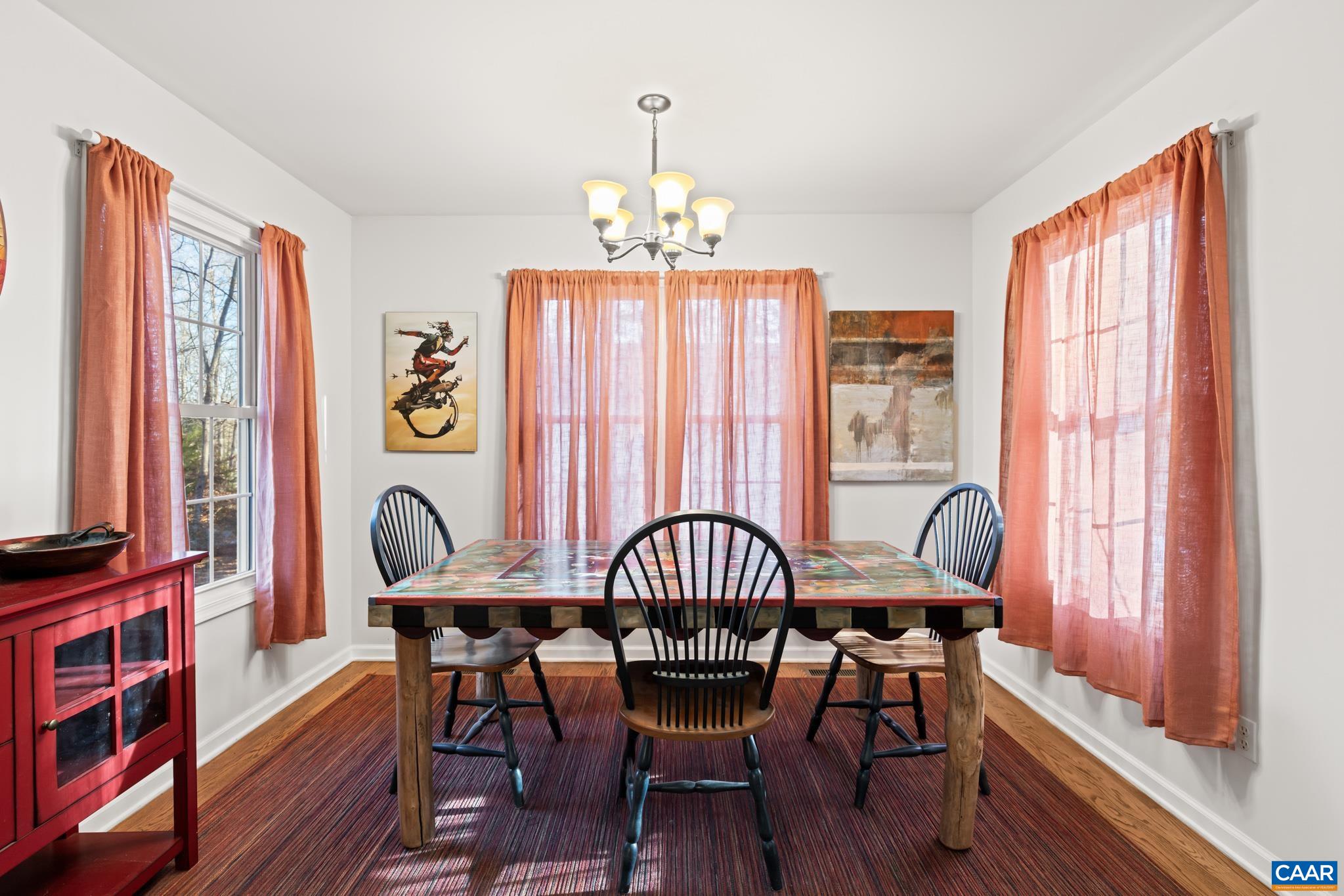 Open floor plan. Enjoy winter water views of Beach 2 from this dining area. Also enjoy the company of others lounging in front of the fireplace with this adjoining space.