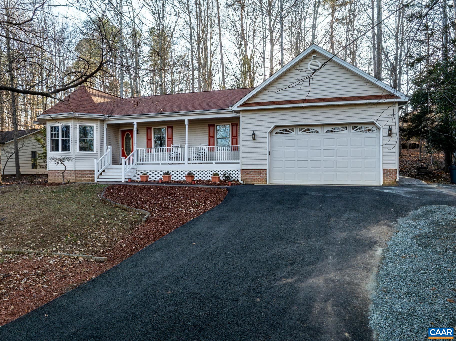 Drive up this asphalt driveway with an abundance of off road parking up to the oversized 2c garage