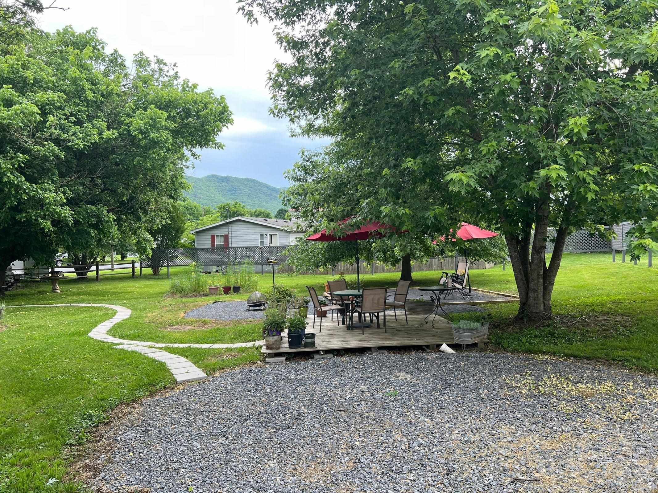 Owners added gravel area in back yard to enhance it's usage. Owners added gravel area in back yard to enhance it's usage.