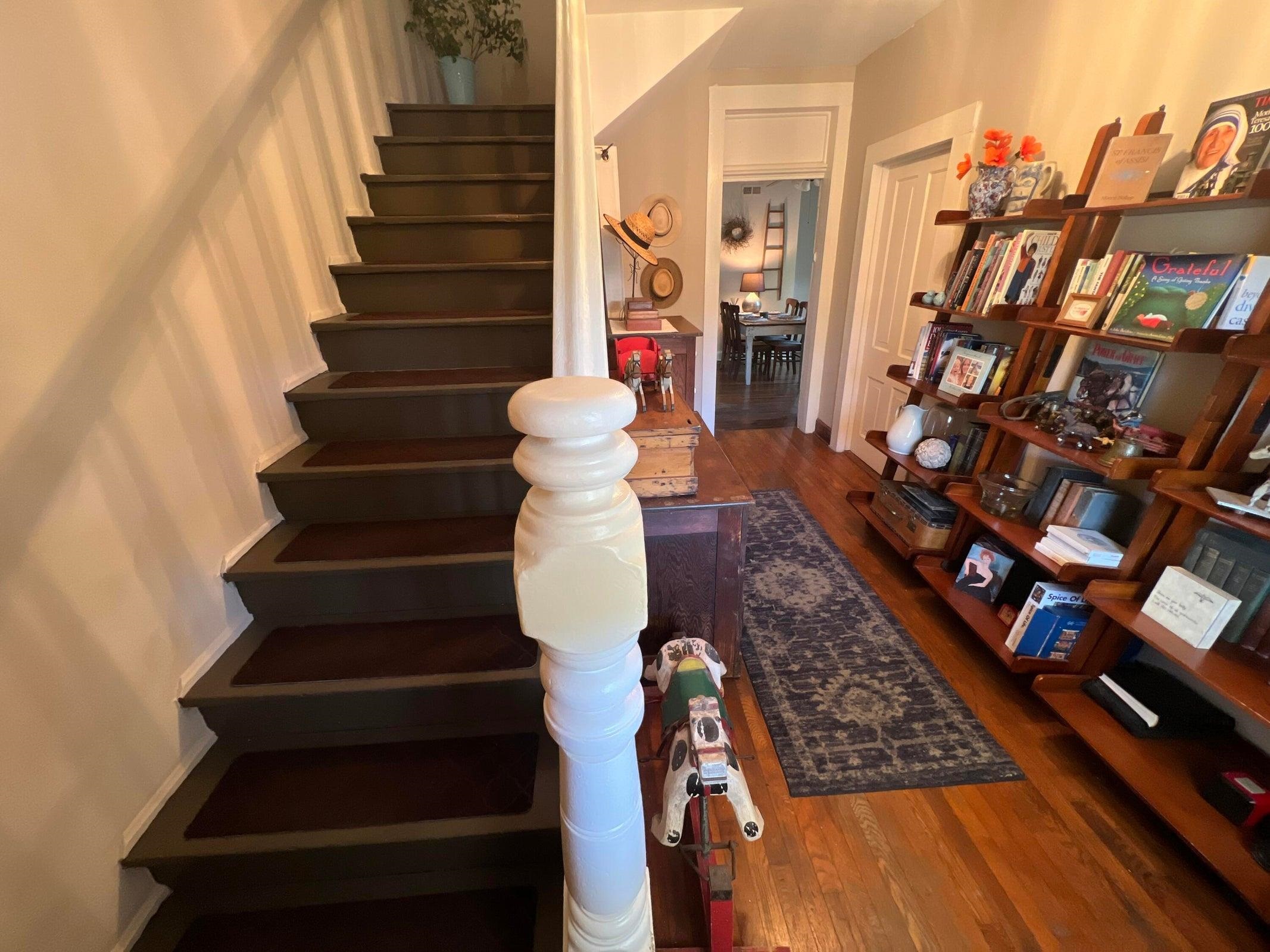 Stairs to the second floor from the foyer. Stairs to the second floor from the foyer.