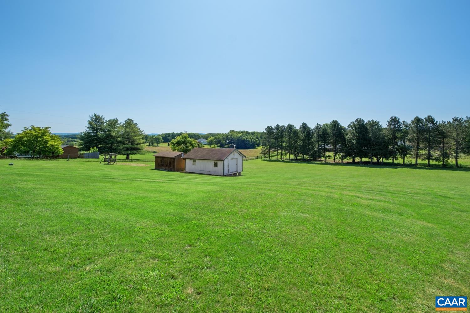 The backyard is large and fenced.