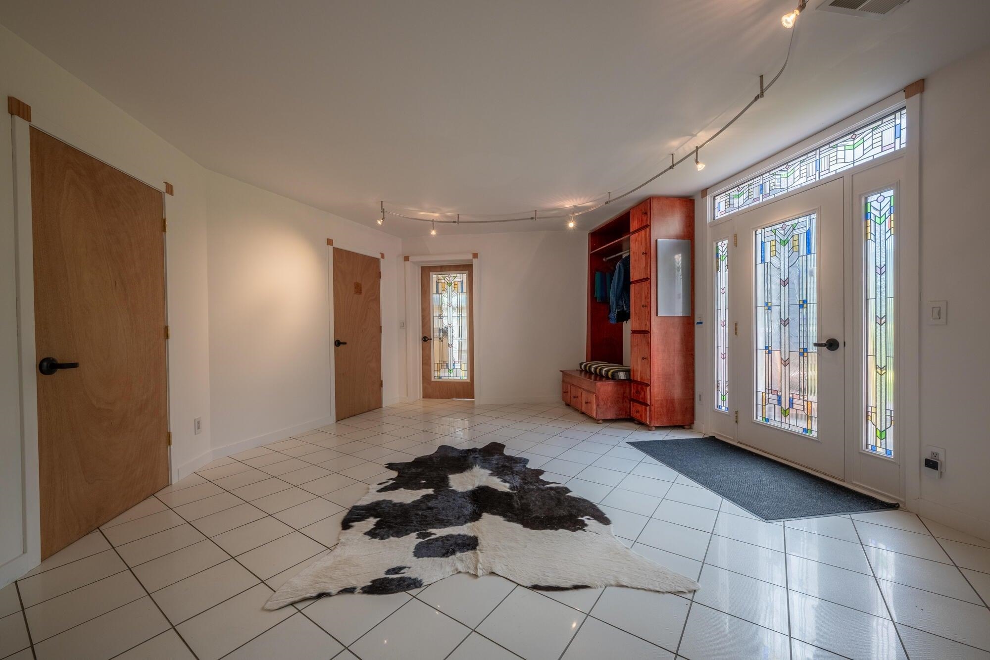 Light-filled entrance between the 2 dome living structures.