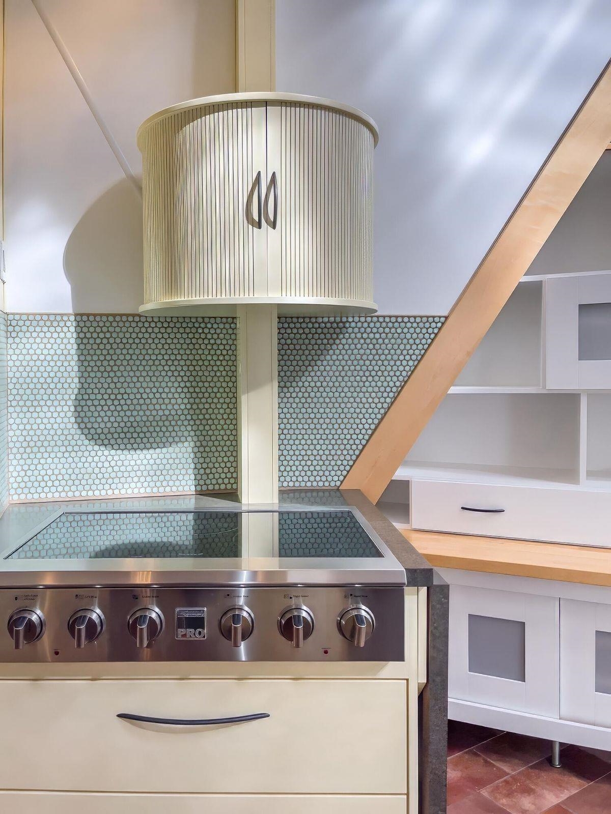 Access to spices and seasonings are directly above the stove top.