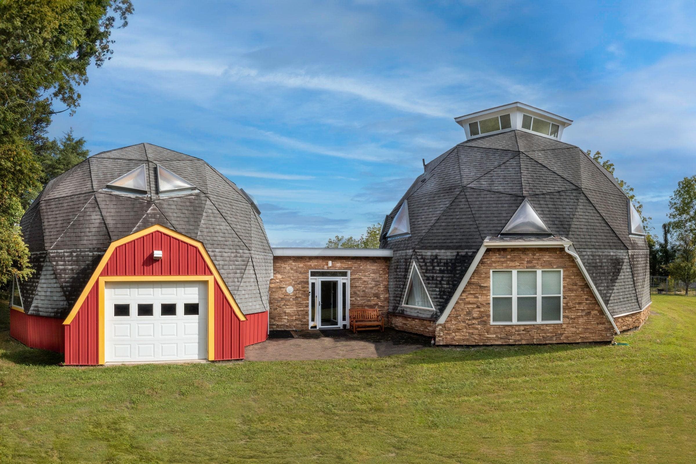 Two well-built dome houses, connected by a vestibule