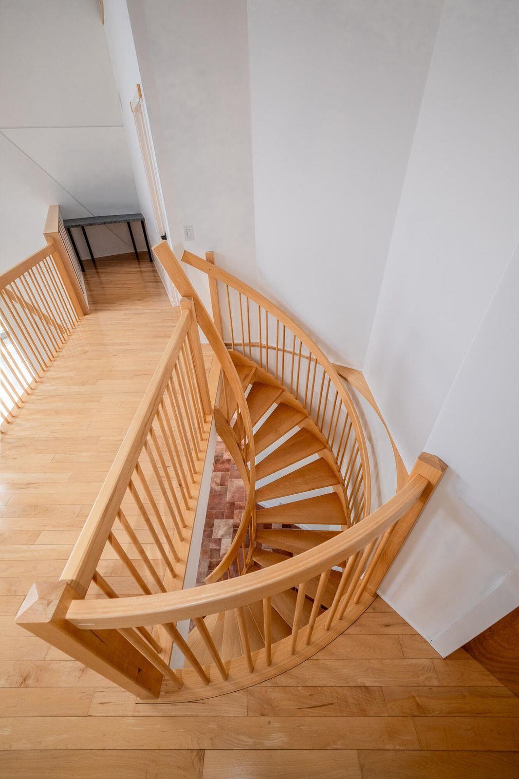 Unique, artistic, custom-built spiral staircase to the 2nd floor.