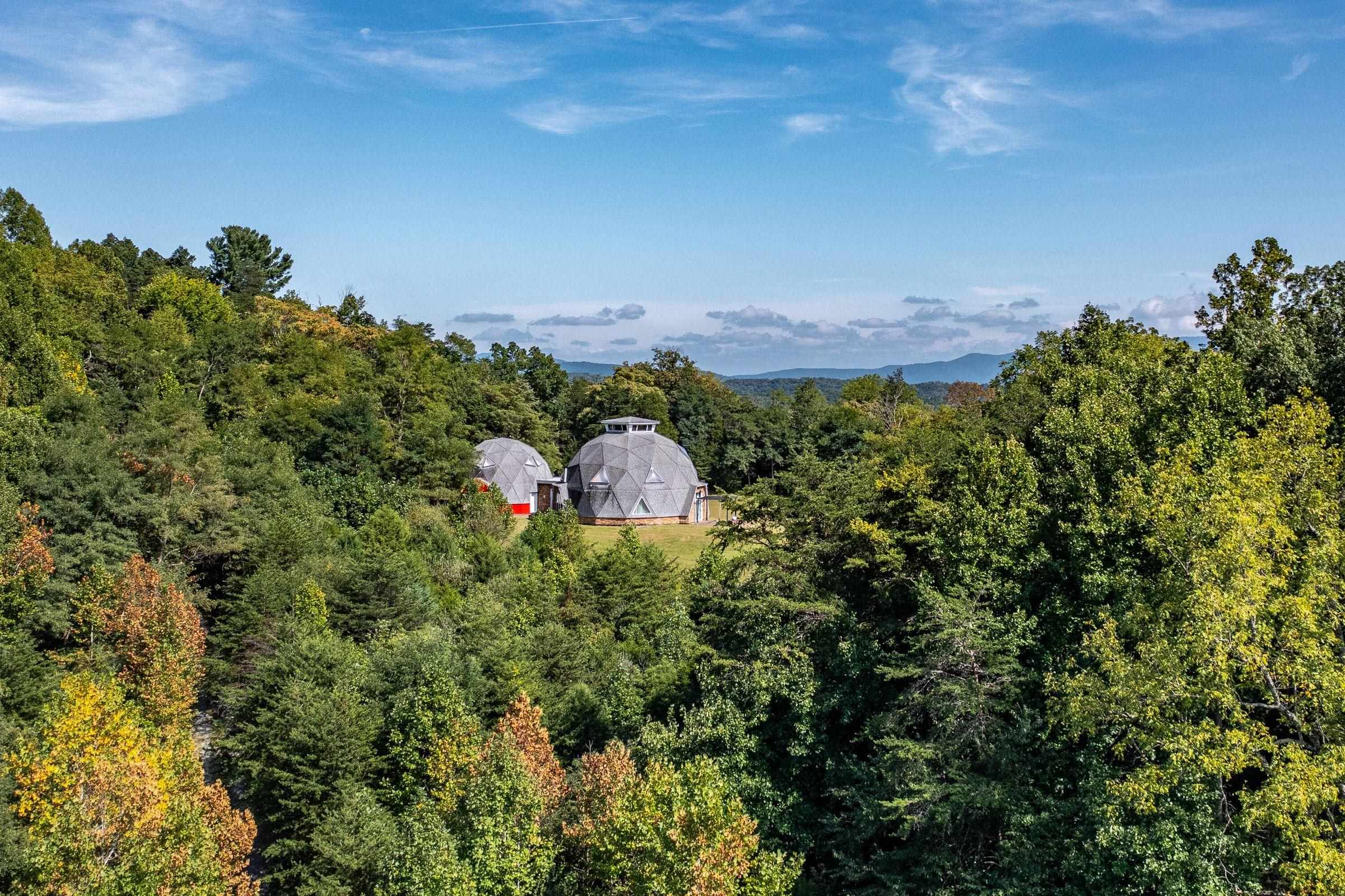 The dome homes are positioned in the midst of spacious lawns and forest.