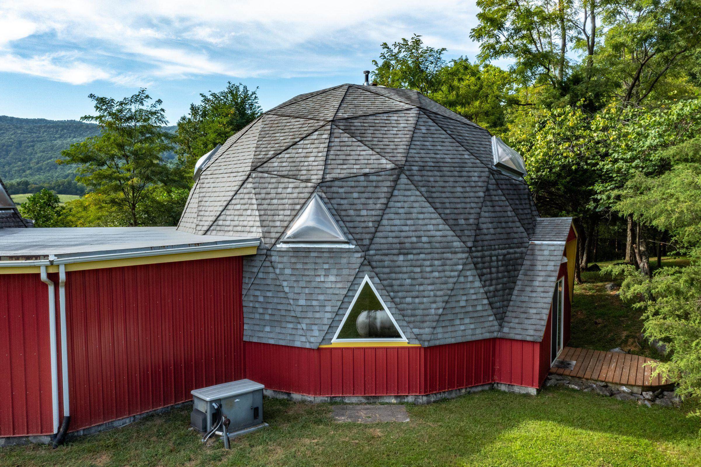 Behind the small dome.