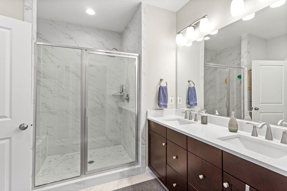 Nice walk-in shower and large double vanity!