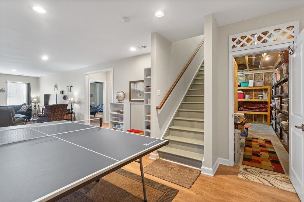 in lower level with game area. Shows entrance to bedroom and family area and storage area.