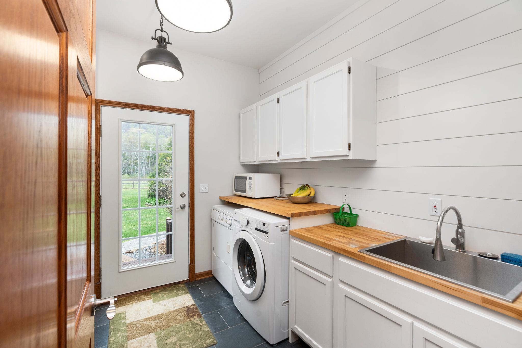 with exterior access and laundry sink.