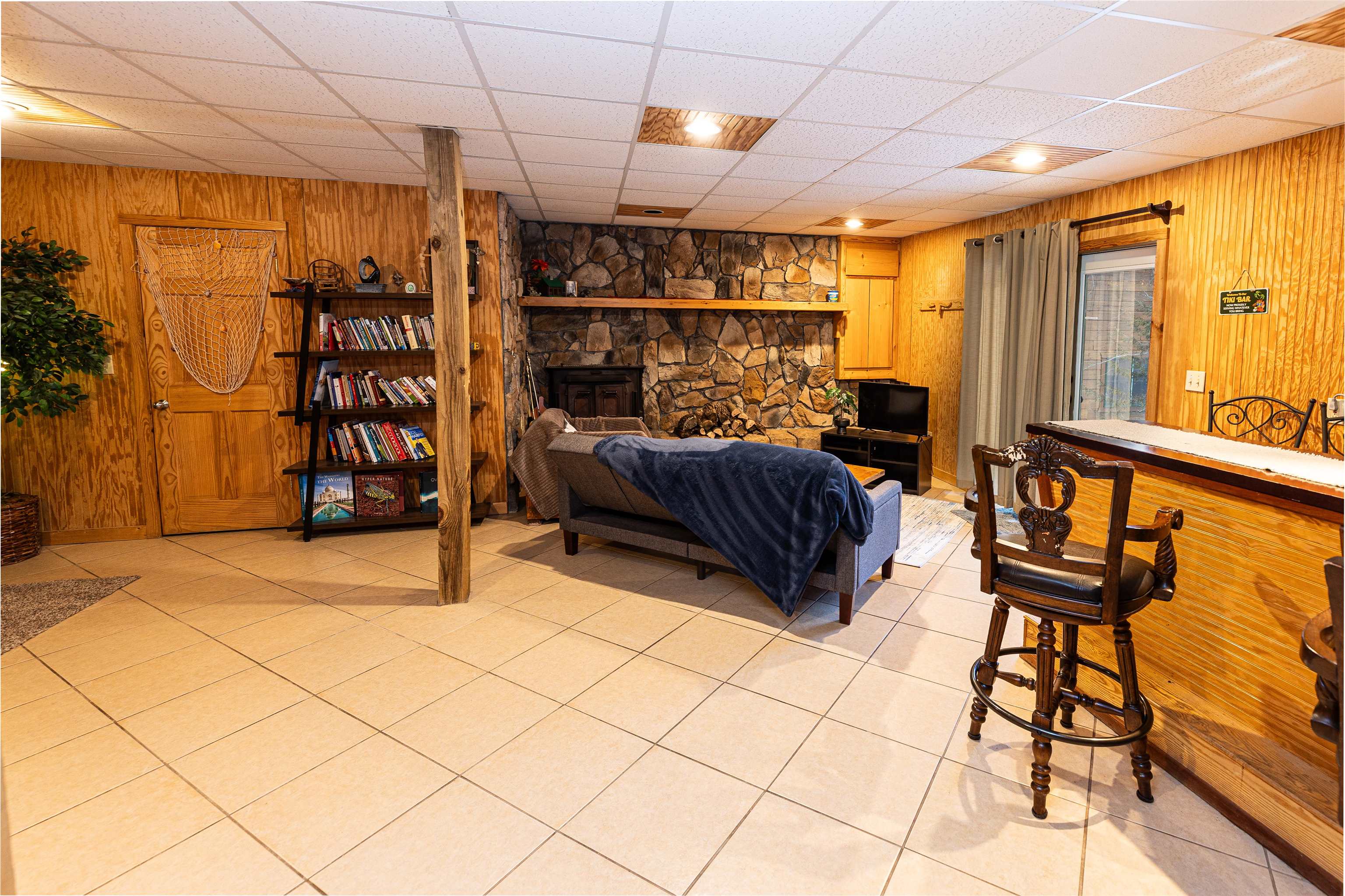 Rec room w/ fireplace & access to lower level patio