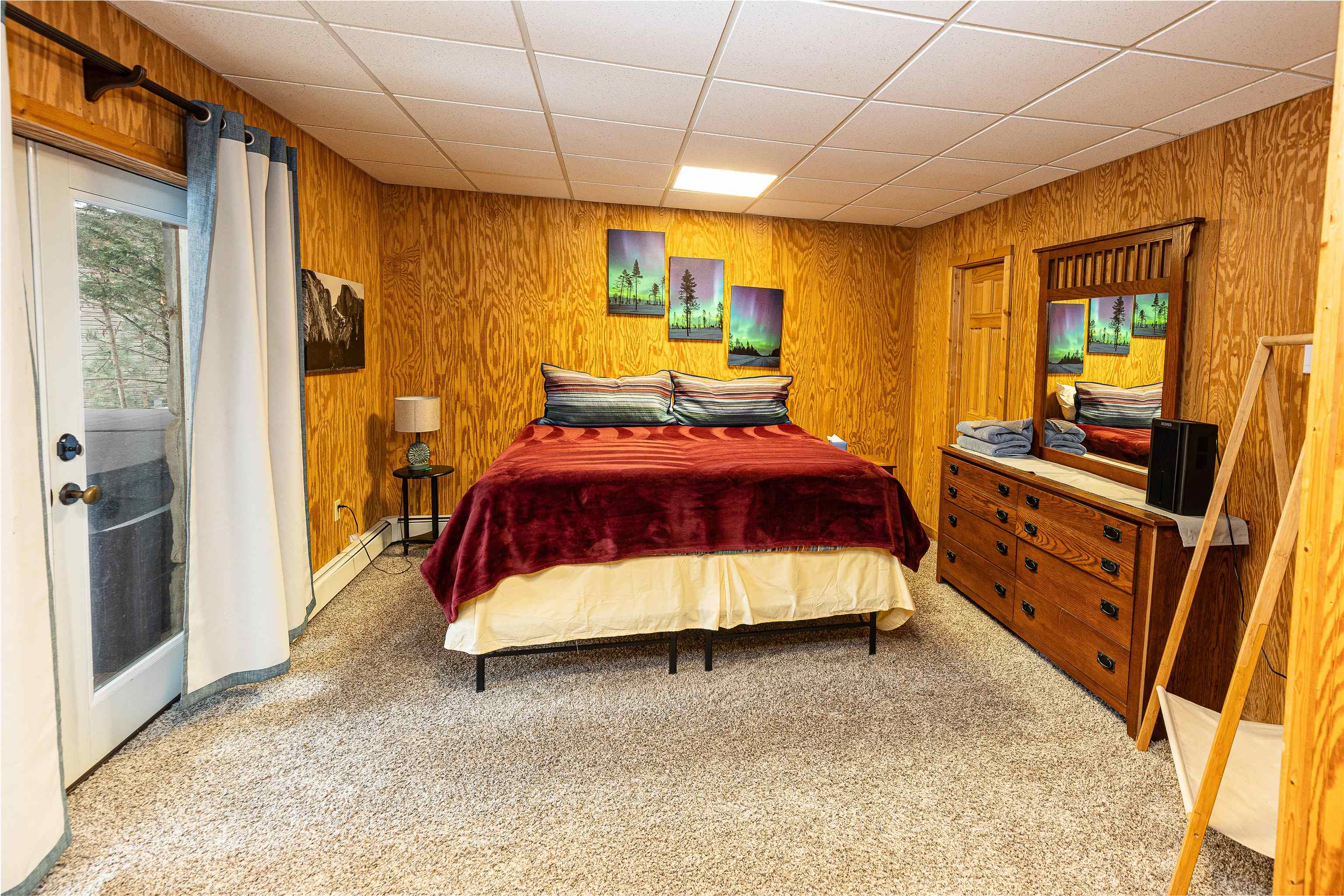 Basement level bedroom with access to lower patio & hottub.