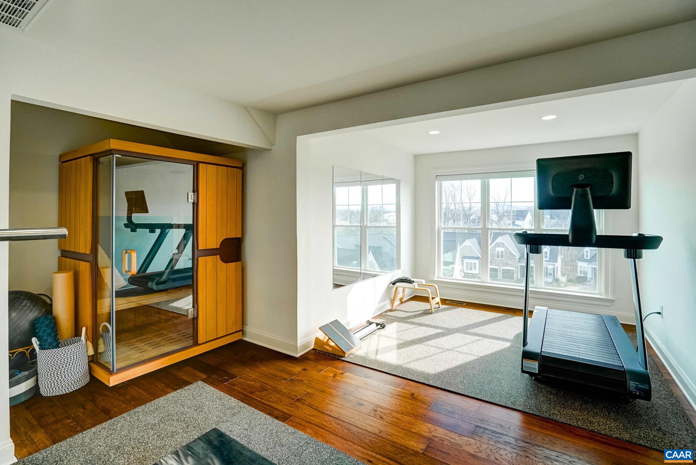 Light-filled workout space on top level is an amazing space with incredible views!