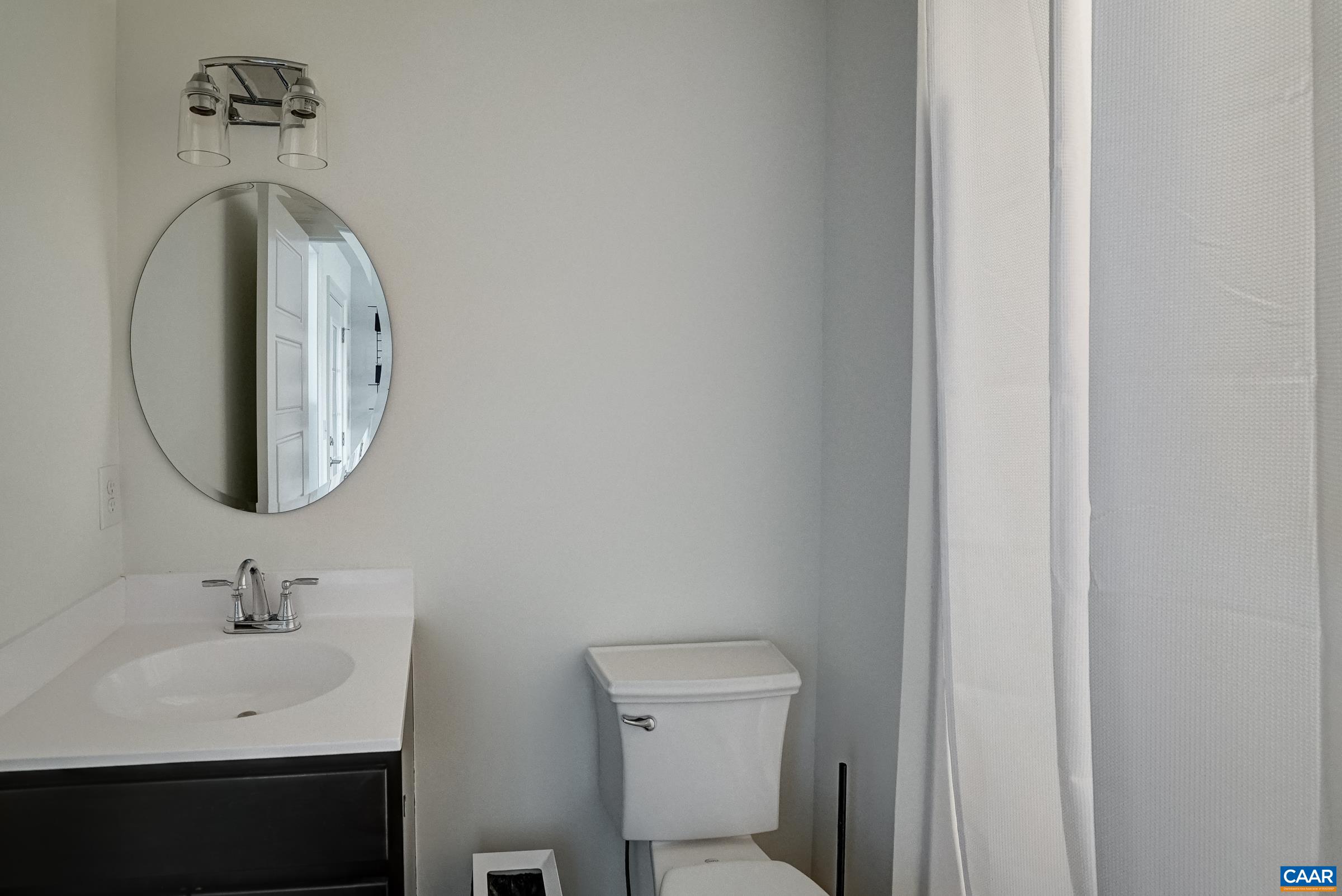 Fourth floor full bathroom features a walk-in shower.