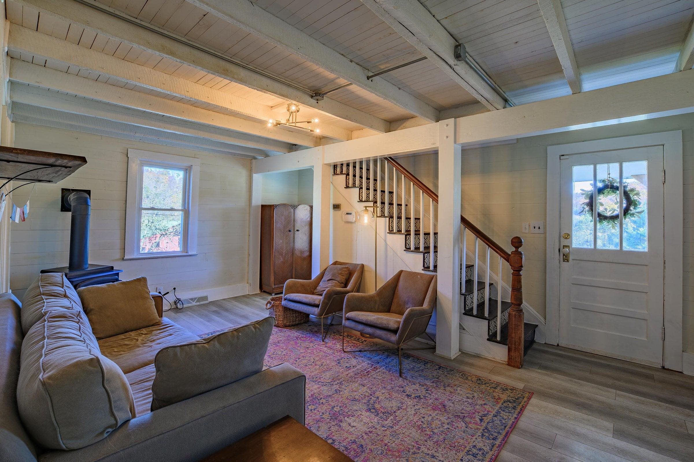 Inside, the farmhouse has been thoughtfully updated — bright, inviting, and full of character.