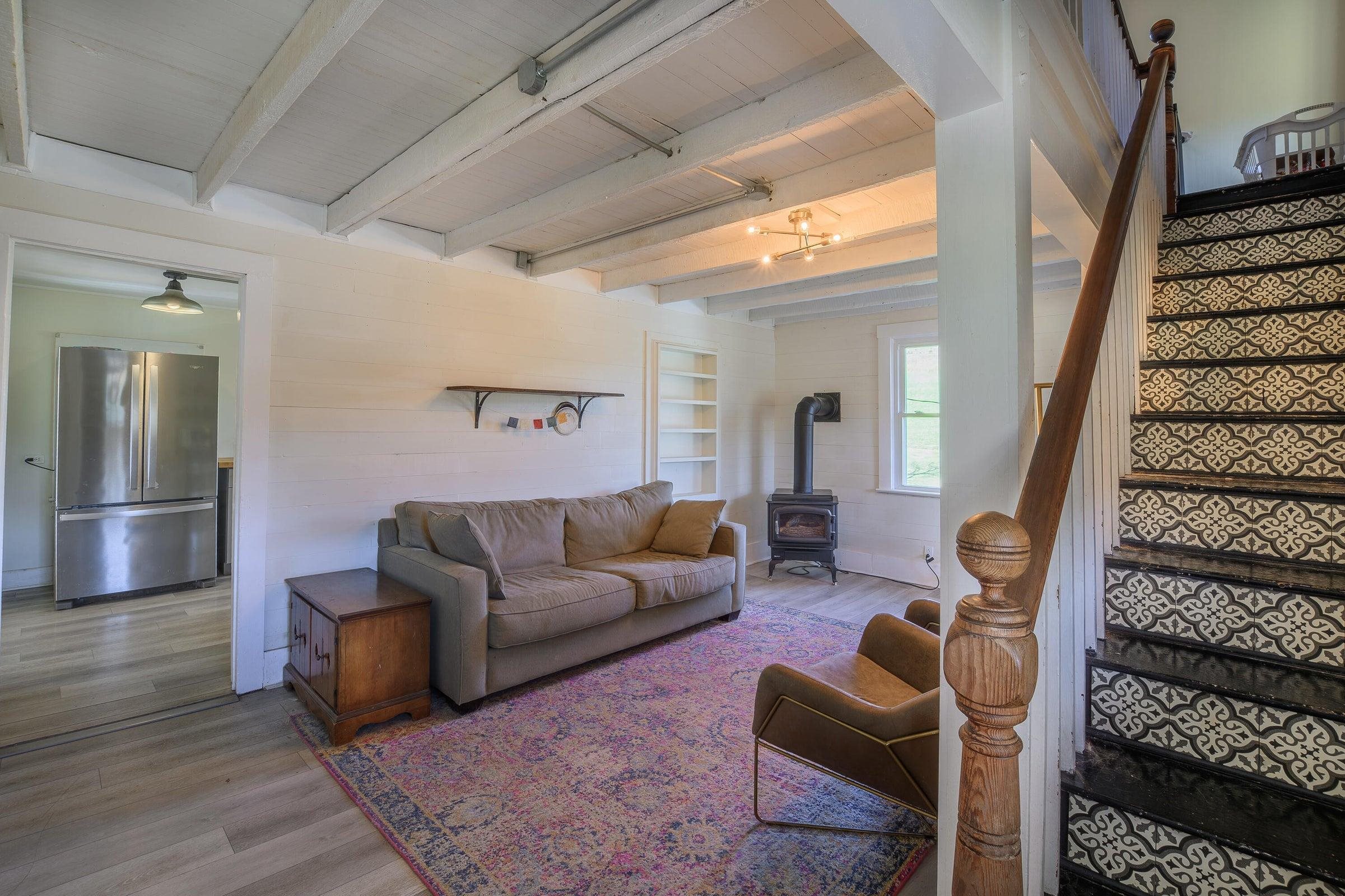 Living room complete with a stove.