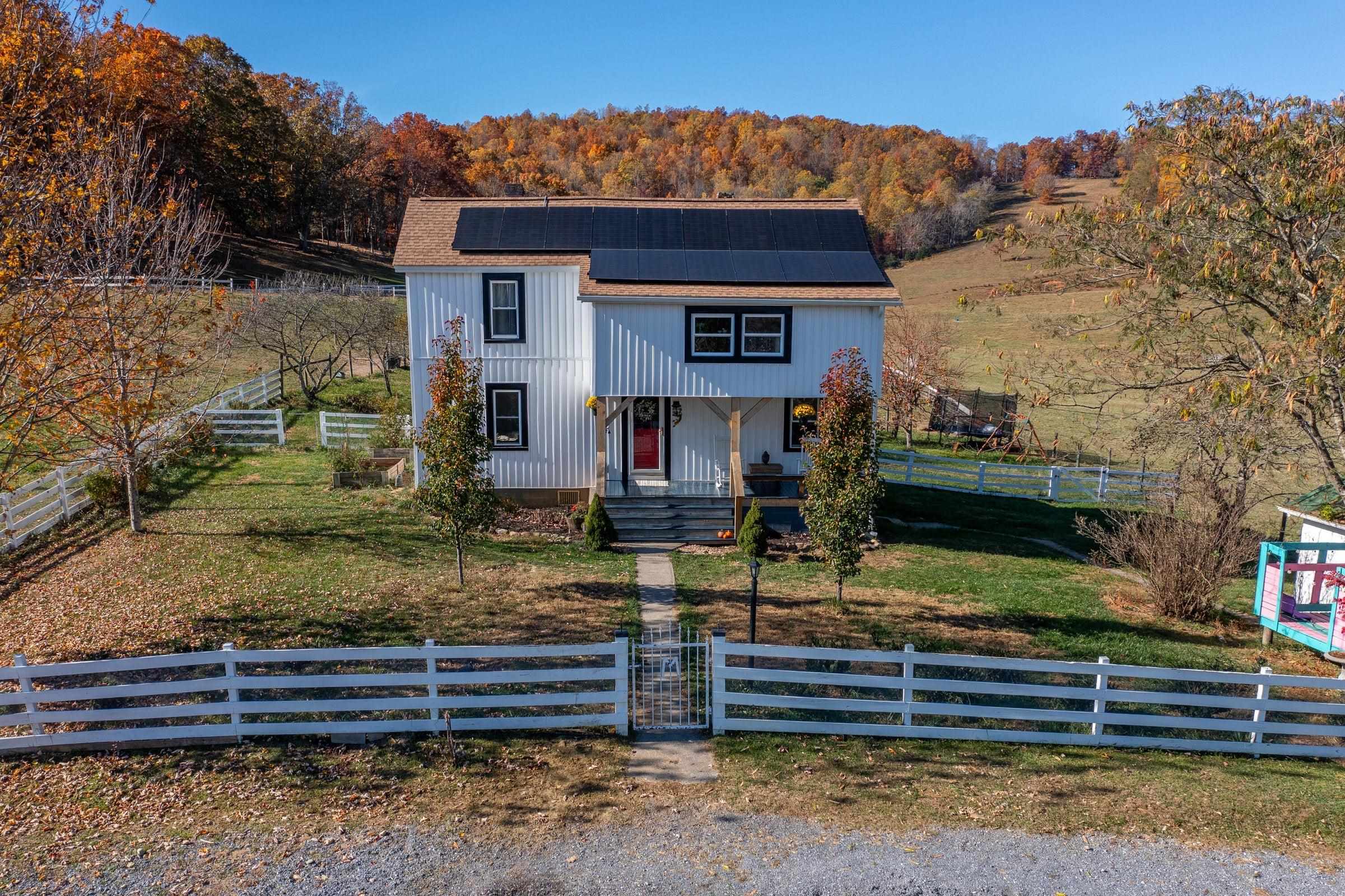 This sweetly renovated 4-bedroom, 2-bath farmhouse sits on 16.13 beautiful acres.